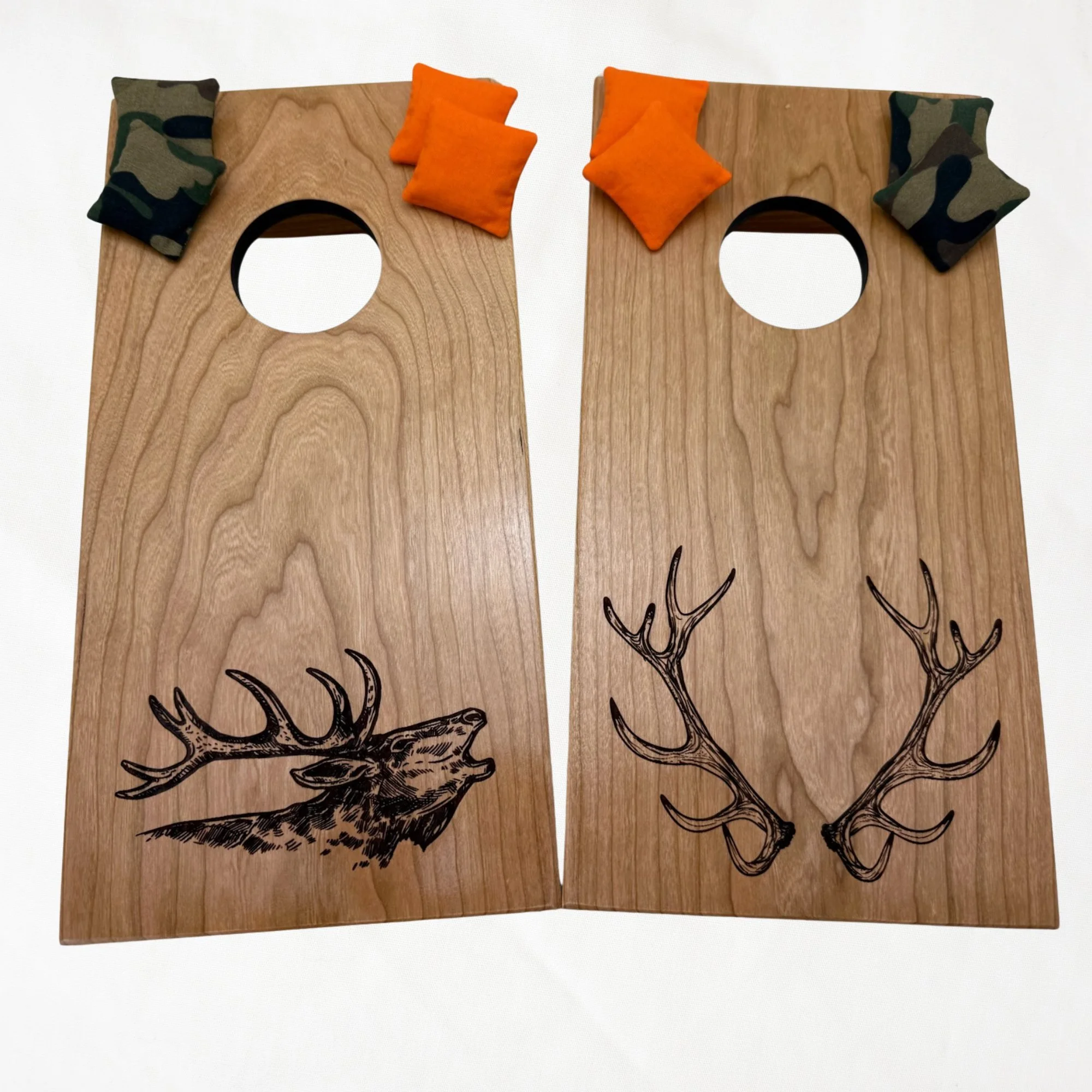 Handcrafted tabletop mini cornhole boards made from solid hardwood, cherry wood, engraved with elk