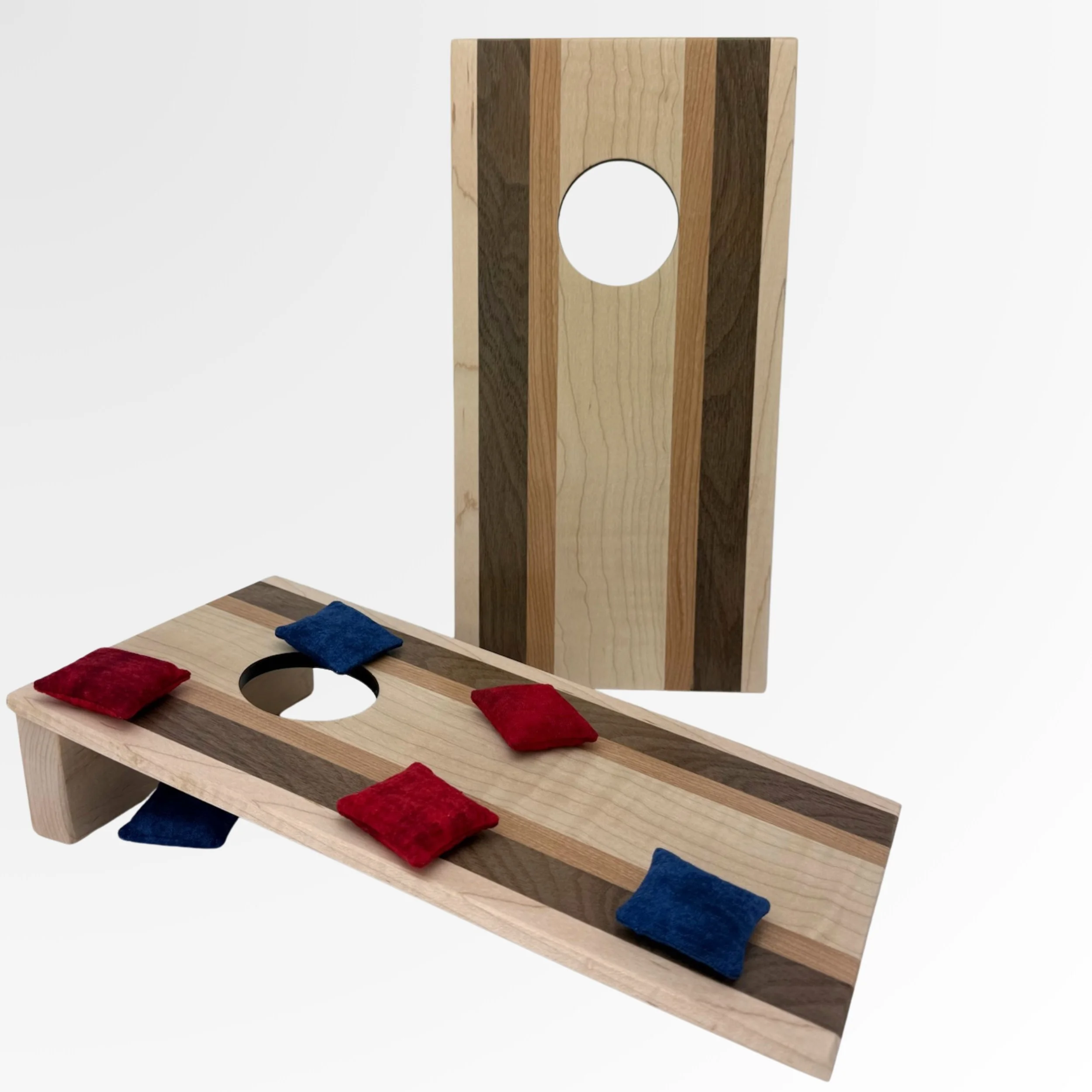 Handcrafted tabletop mini cornhole boards made from solid hardwood, curly maple with a walnut and cherry wood strip