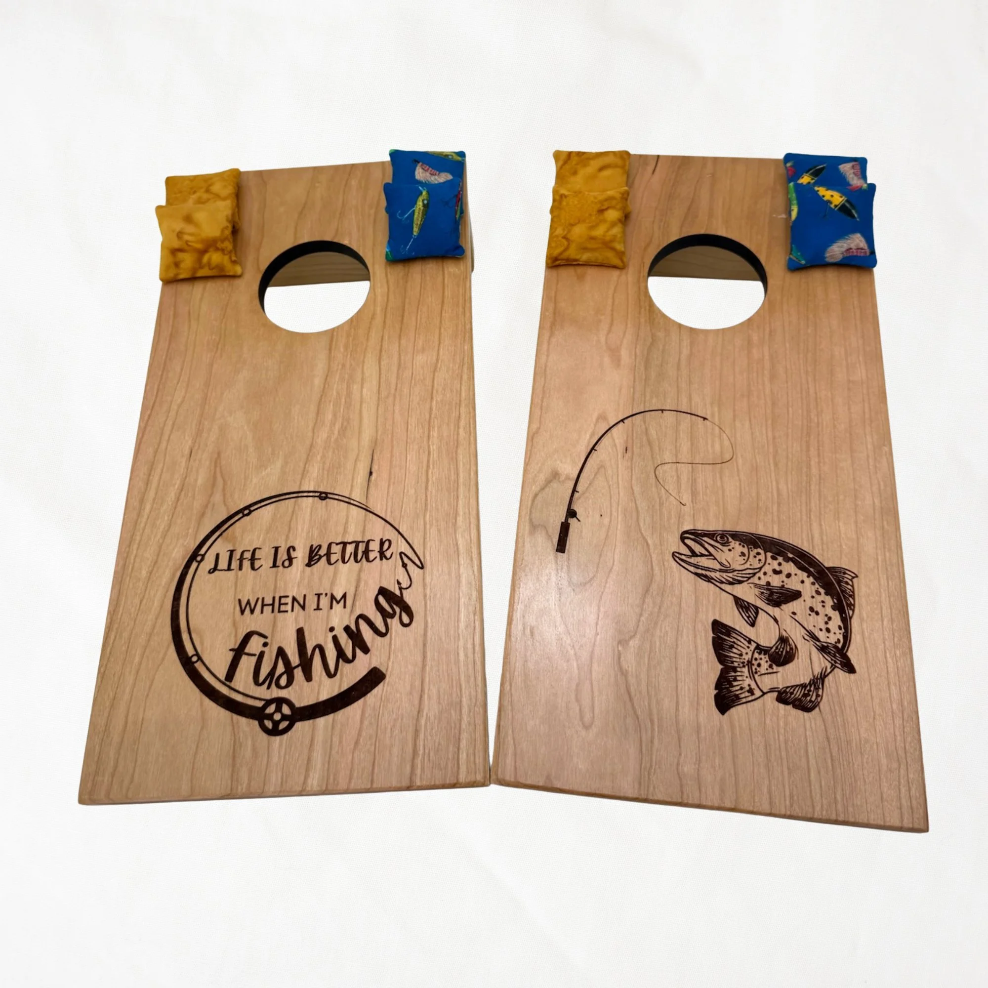 Handcrafted tabletop mini cornhole boards made from solid hardwood, cherry wood, engraved with fishing life