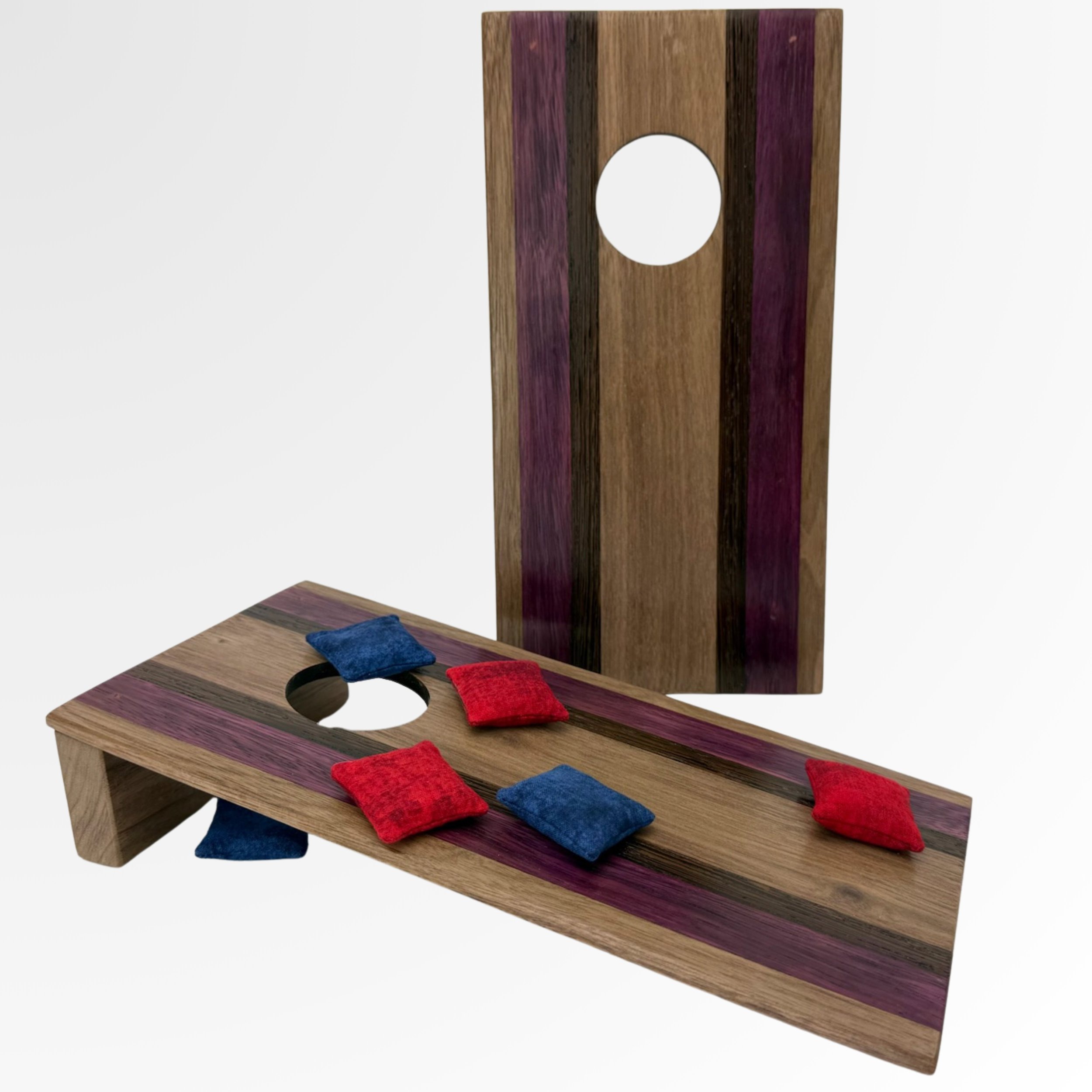 Handcrafted tabletop mini cornhole boards made from solid hardwood, zebra wood, Purple Heart, and black wenge