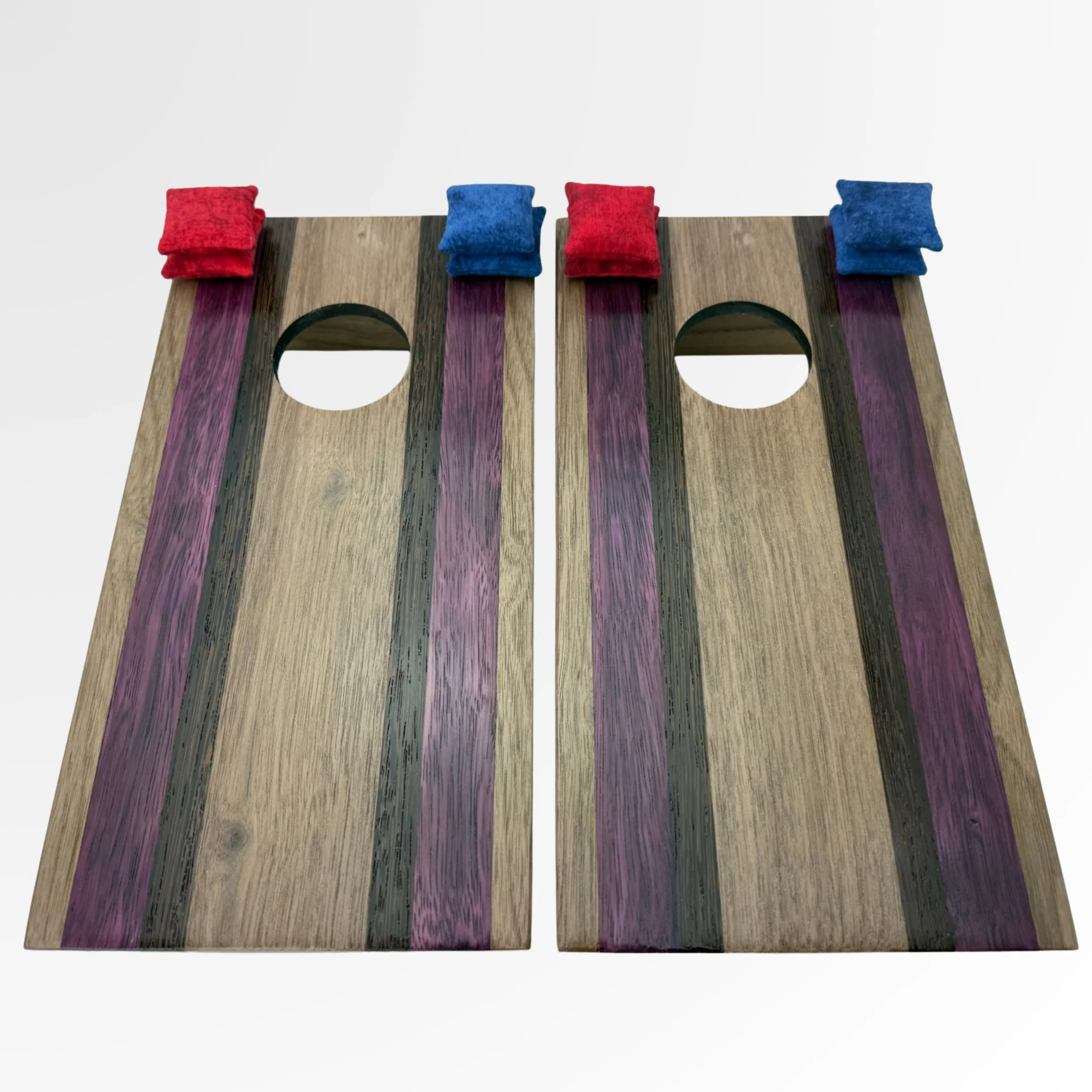 Handcrafted tabletop mini cornhole boards made from solid hardwood, zebra wood, Purple Heart, and black wenge