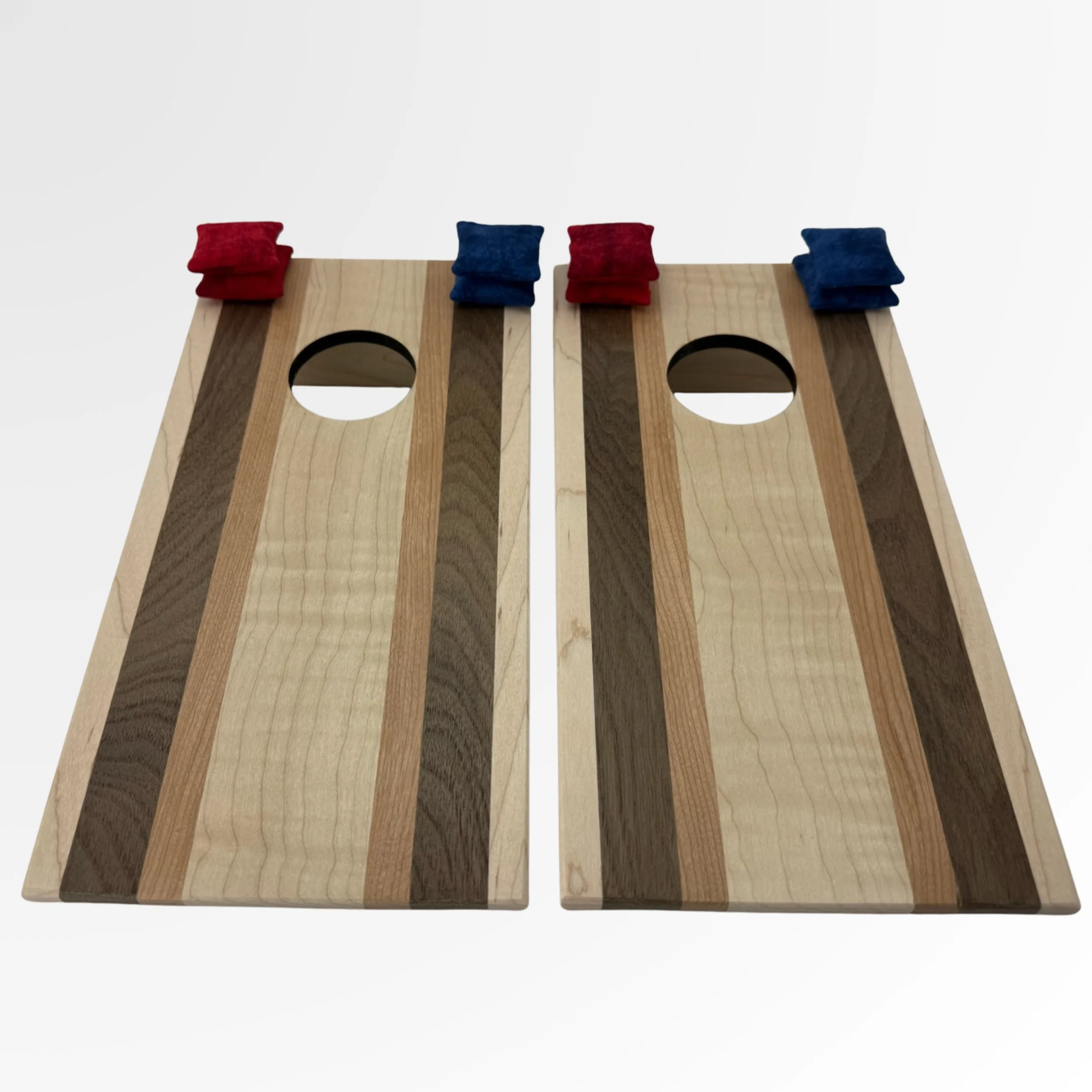 Handcrafted tabletop mini cornhole boards made from solid hardwood, curly maple with a walnut and cherry wood strip