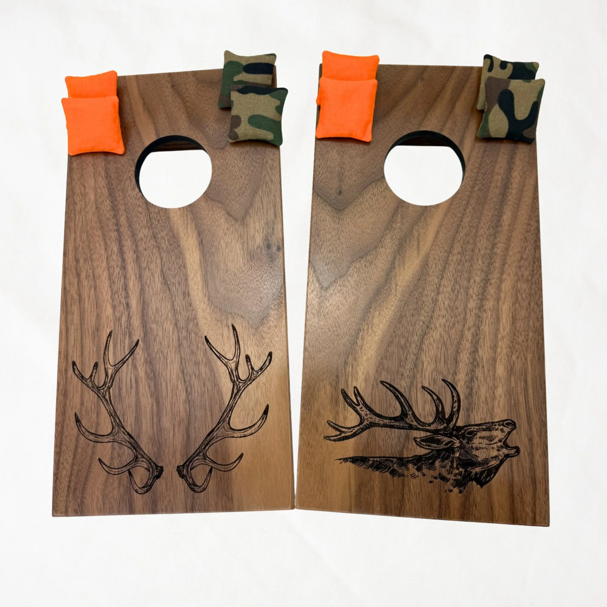 Handcrafted tabletop mini cornhole boards made from solid hardwood, walnut wood, engraved with elk