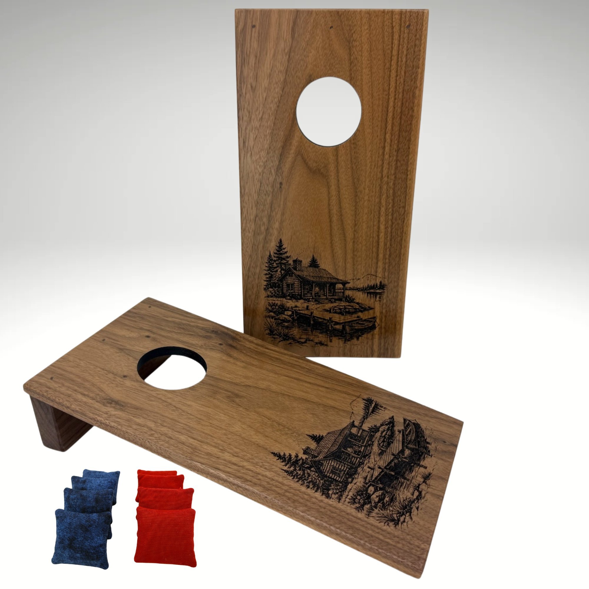 Handcrafted tabletop mini cornhole boards made from solid hardwood, walnut wood, and engraved with a cabin