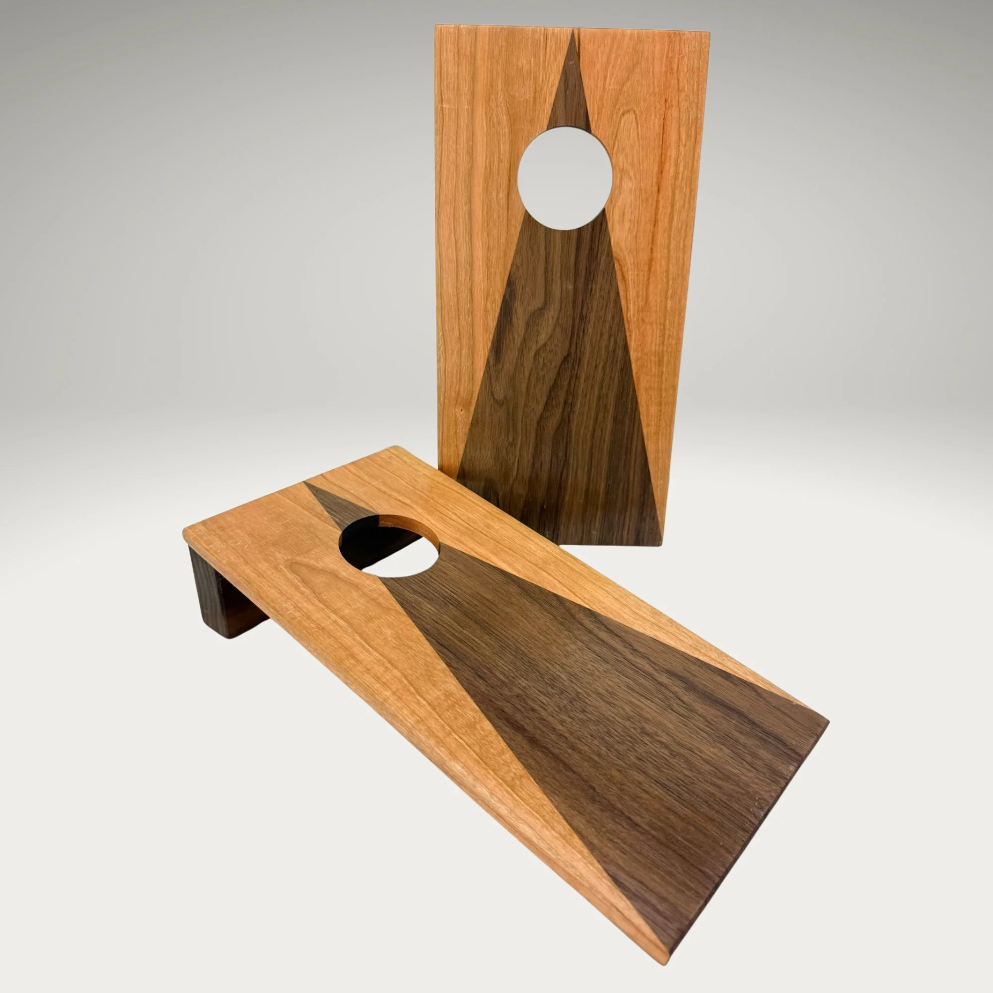 Handcrafted tabletop mini cornhole boards made from solid hardwood, two-tone cherry and walnut wood,