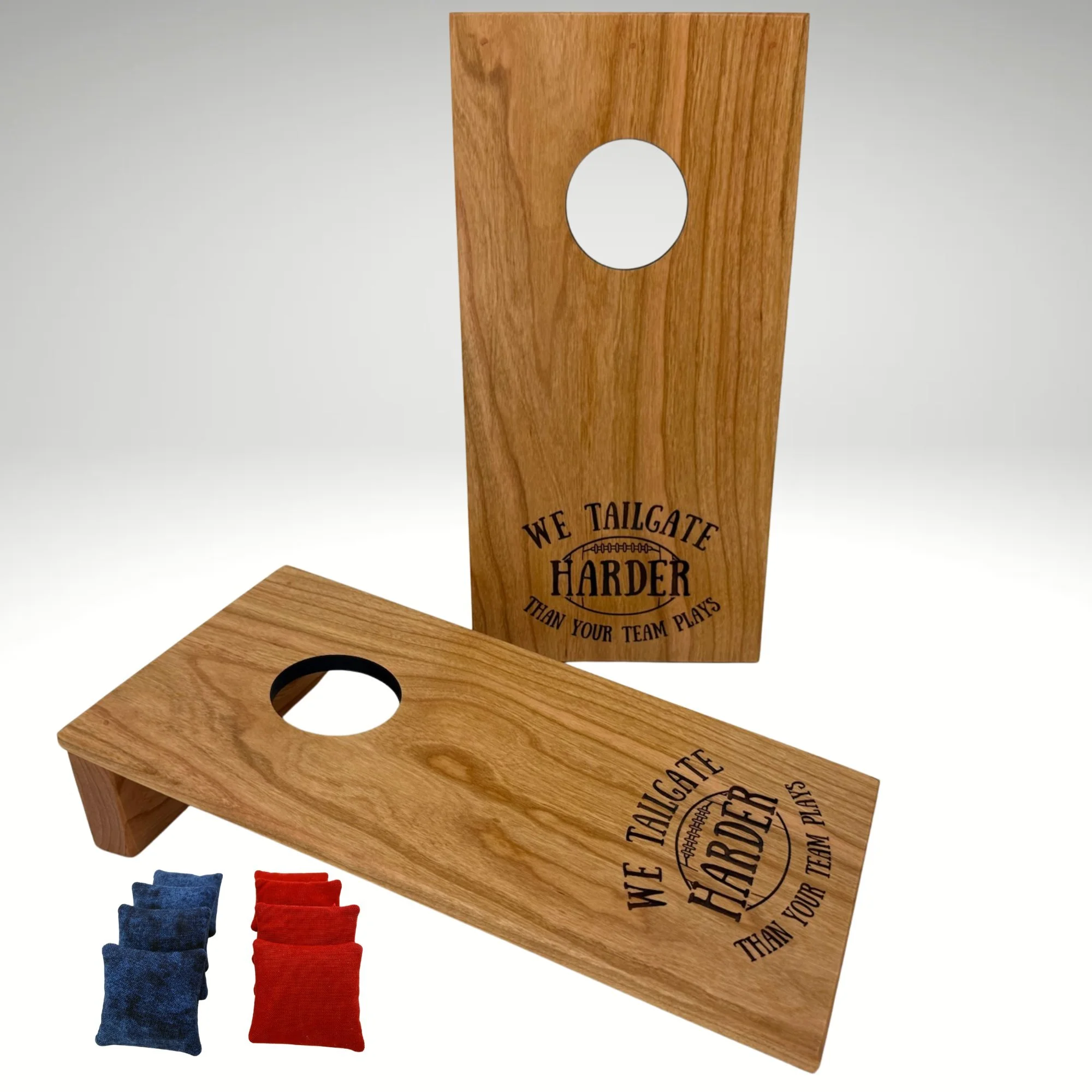 Handcrafted tabletop mini cornhole boards made from solid hardwood, cherry wood, and engraved with tailgating