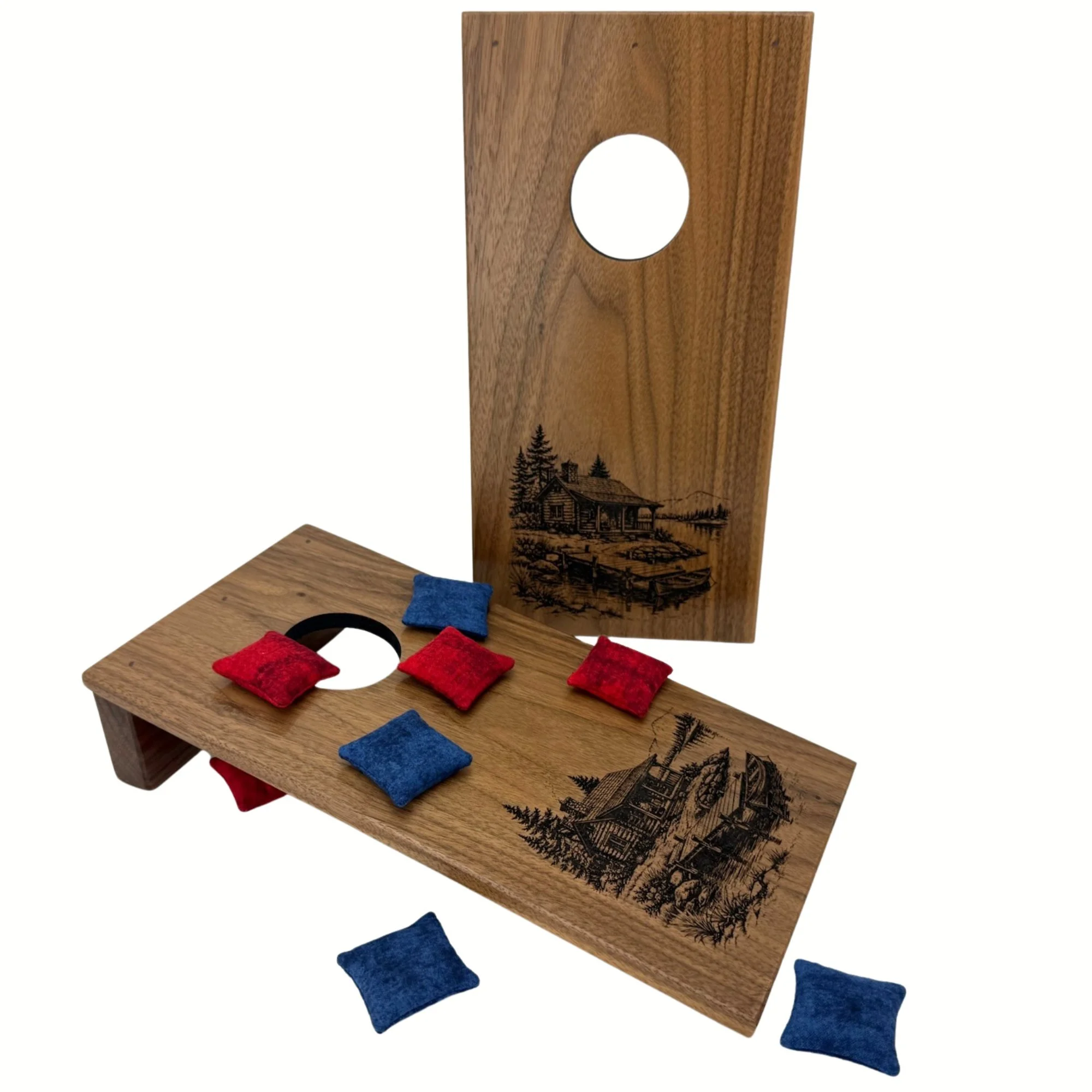 Handcrafted tabletop mini cornhole boards made from solid hardwood, walnut wood, and engraved with a cabin