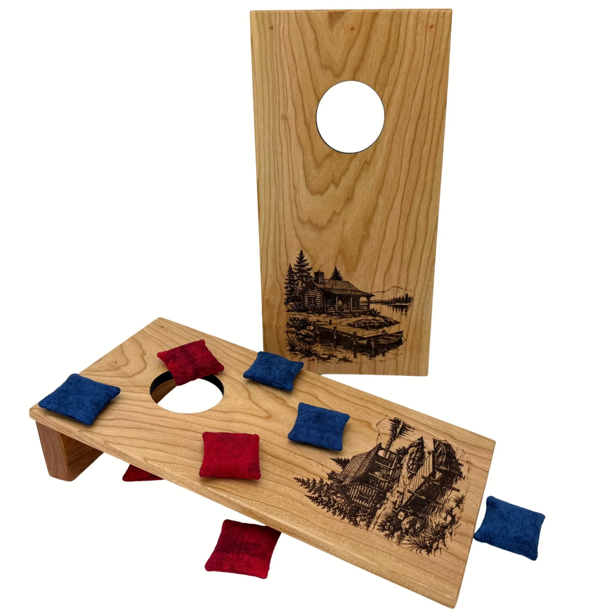 Handcrafted tabletop mini cornhole boards made from solid hardwood, cherry wood, and engraved with a cabin