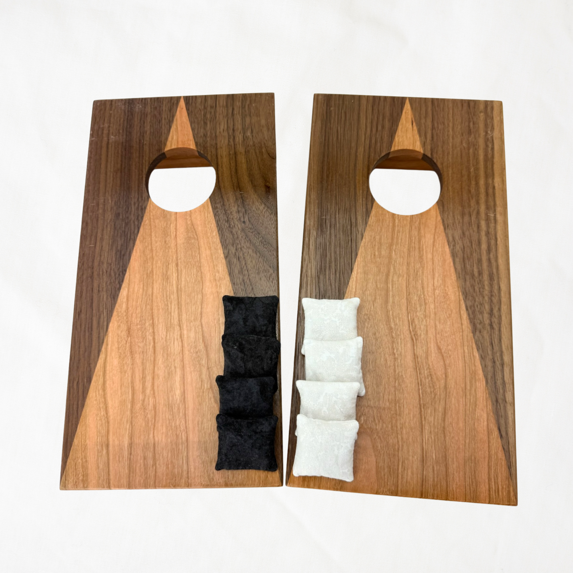 Handcrafted tabletop mini cornhole boards made from solid hardwood, two-tone walnut and cherry wood