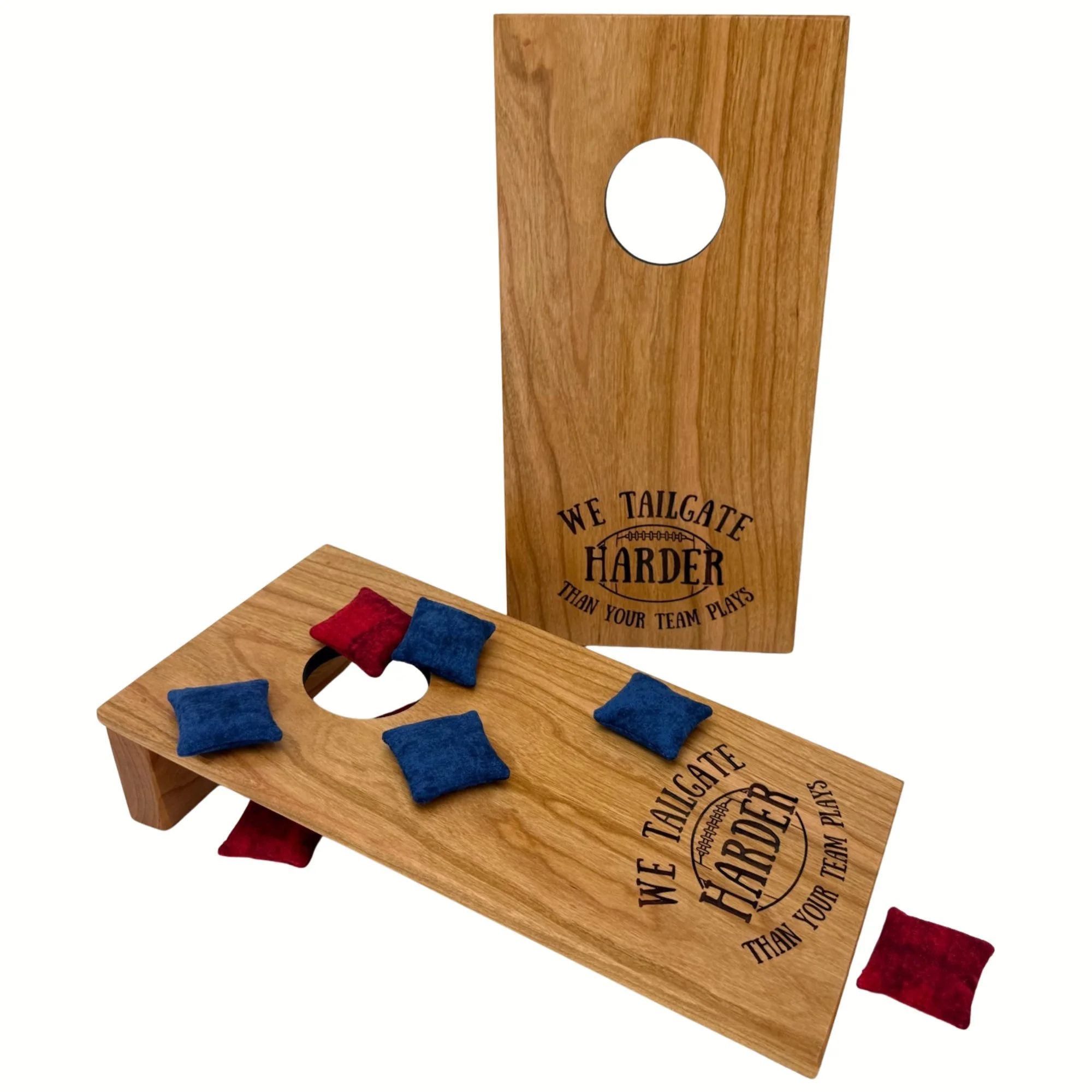 Handcrafted tabletop mini cornhole boards made from solid hardwood, cherry wood, and engraved with tailgating