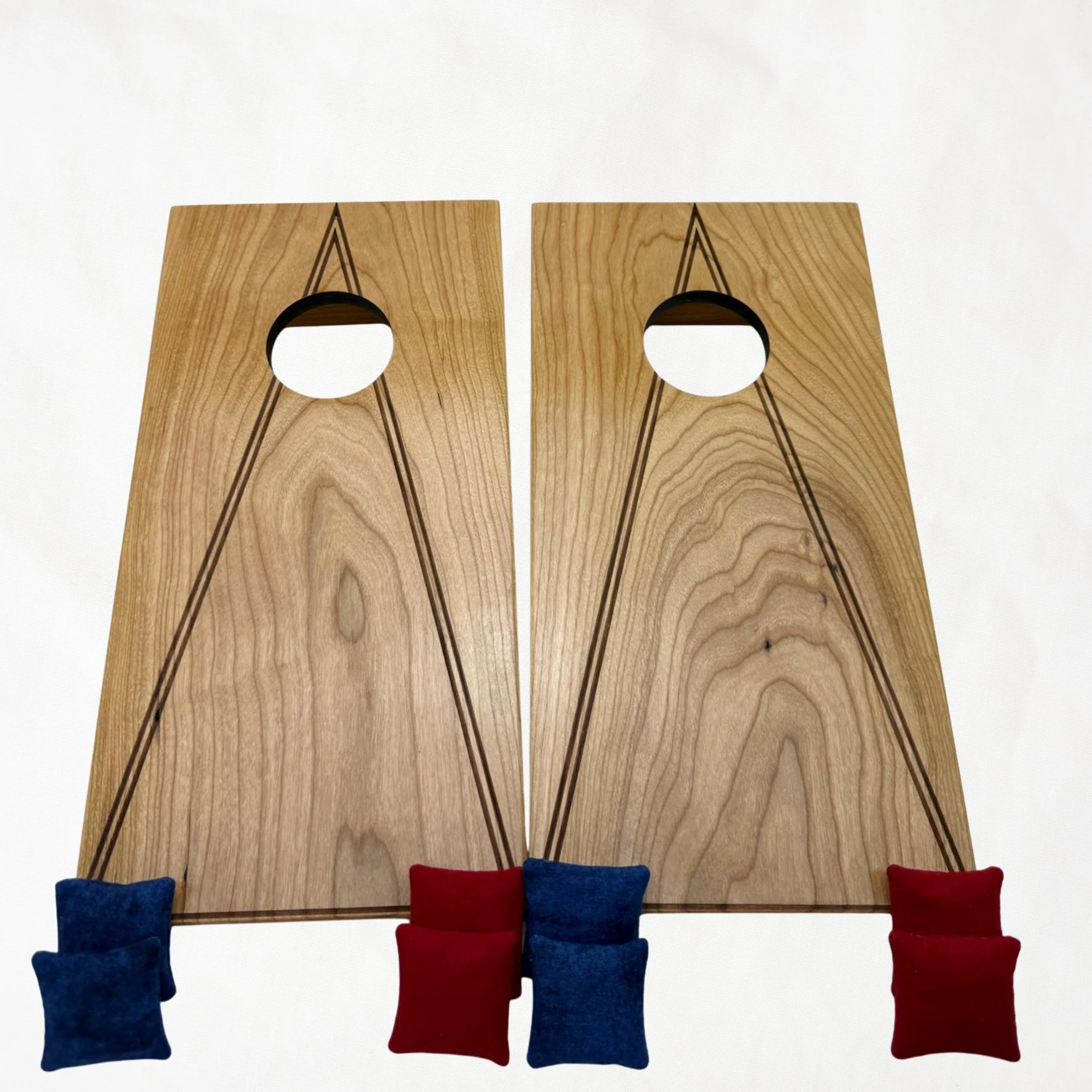 Handcrafted tabletop mini cornhole boards made from solid hardwood, cherry wood, engraved with a triangle