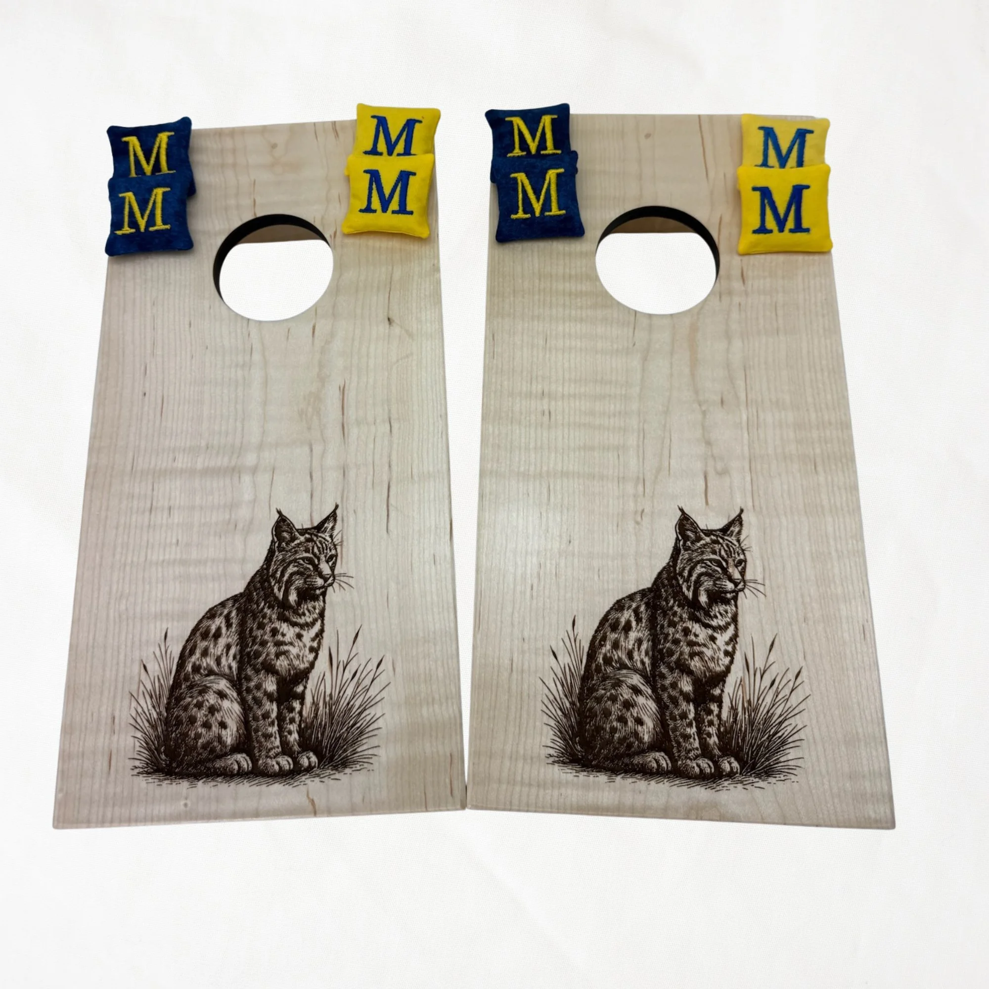 Handcrafted tabletop mini cornhole boards made from solid hardwood, maple wood, engraved with bobcat