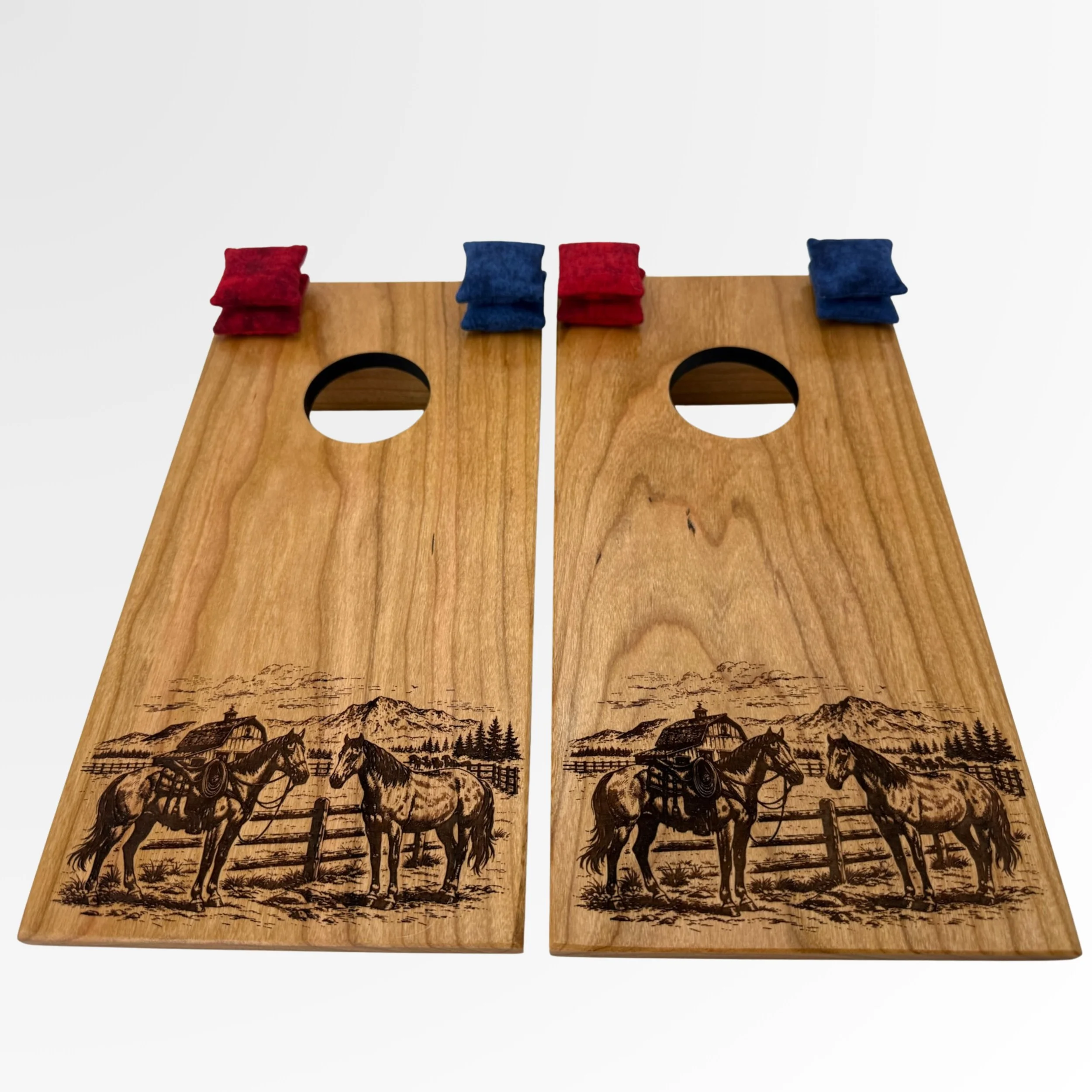 Handcrafted tabletop mini cornhole boards made from solid hardwood, cherry wood engraved with ranch scene