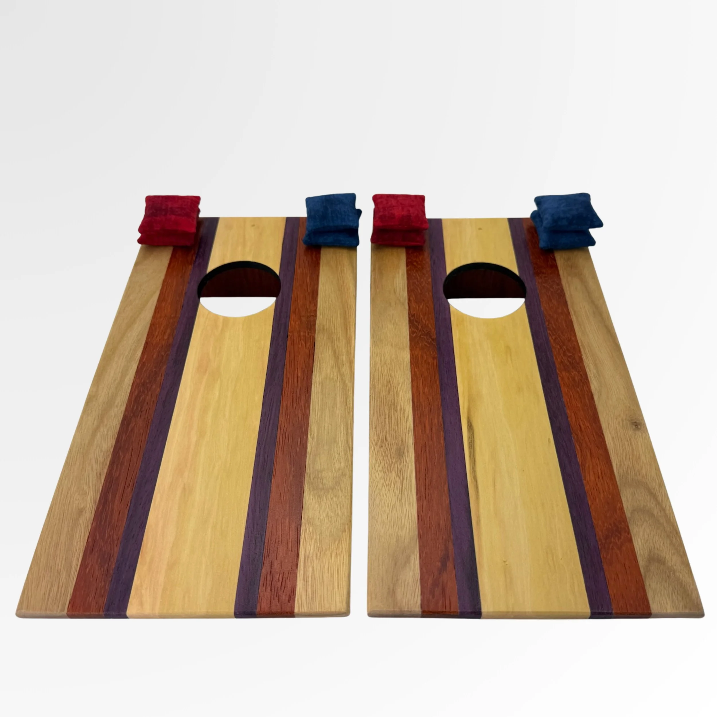 Handcrafted tabletop mini cornhole boards made from solid hardwood, Cherry wood border with exotic hardwoods such as canary, Purple Heart, and padouk