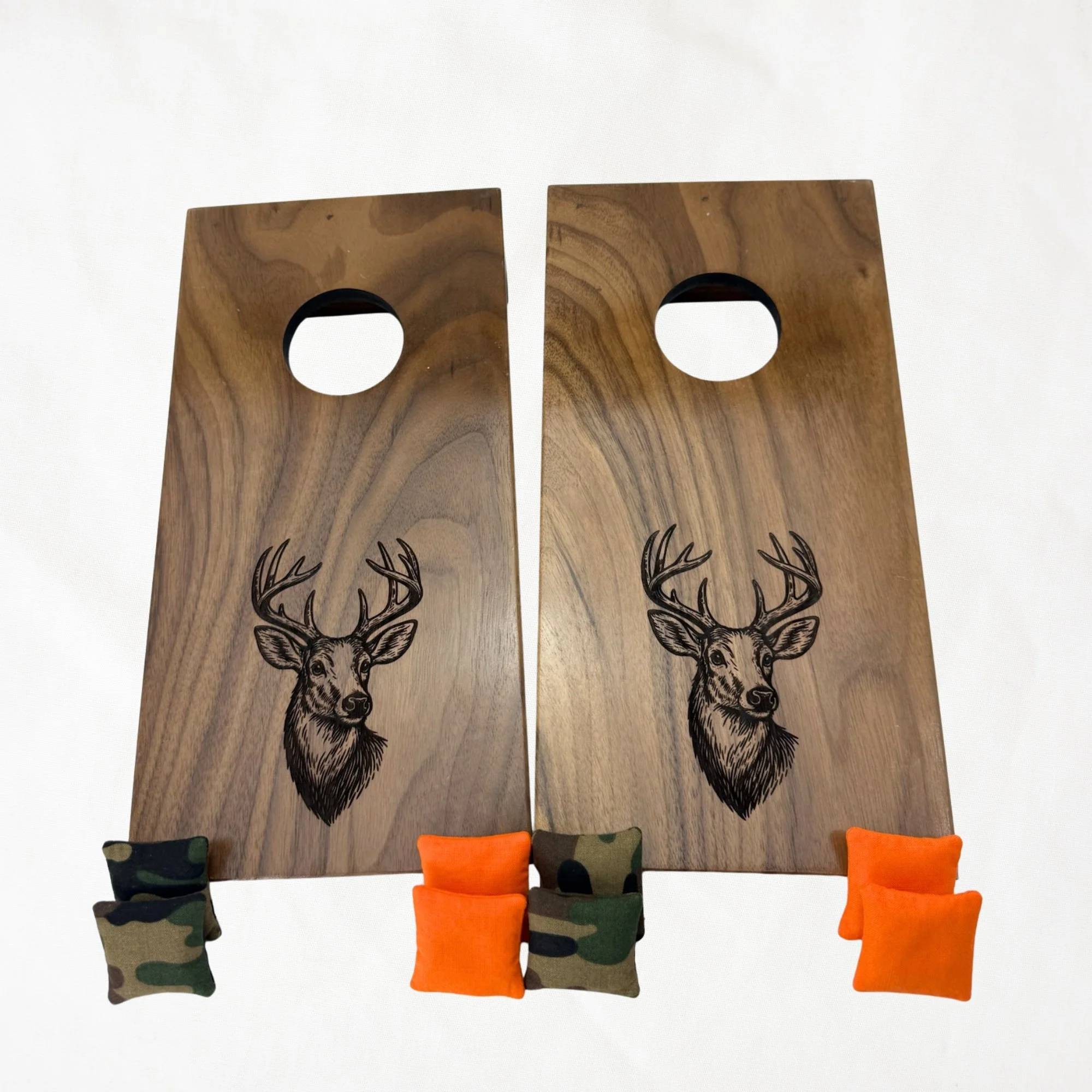 Handcrafted tabletop mini cornhole boards made from solid hardwood, walnut wood, engraved with deer