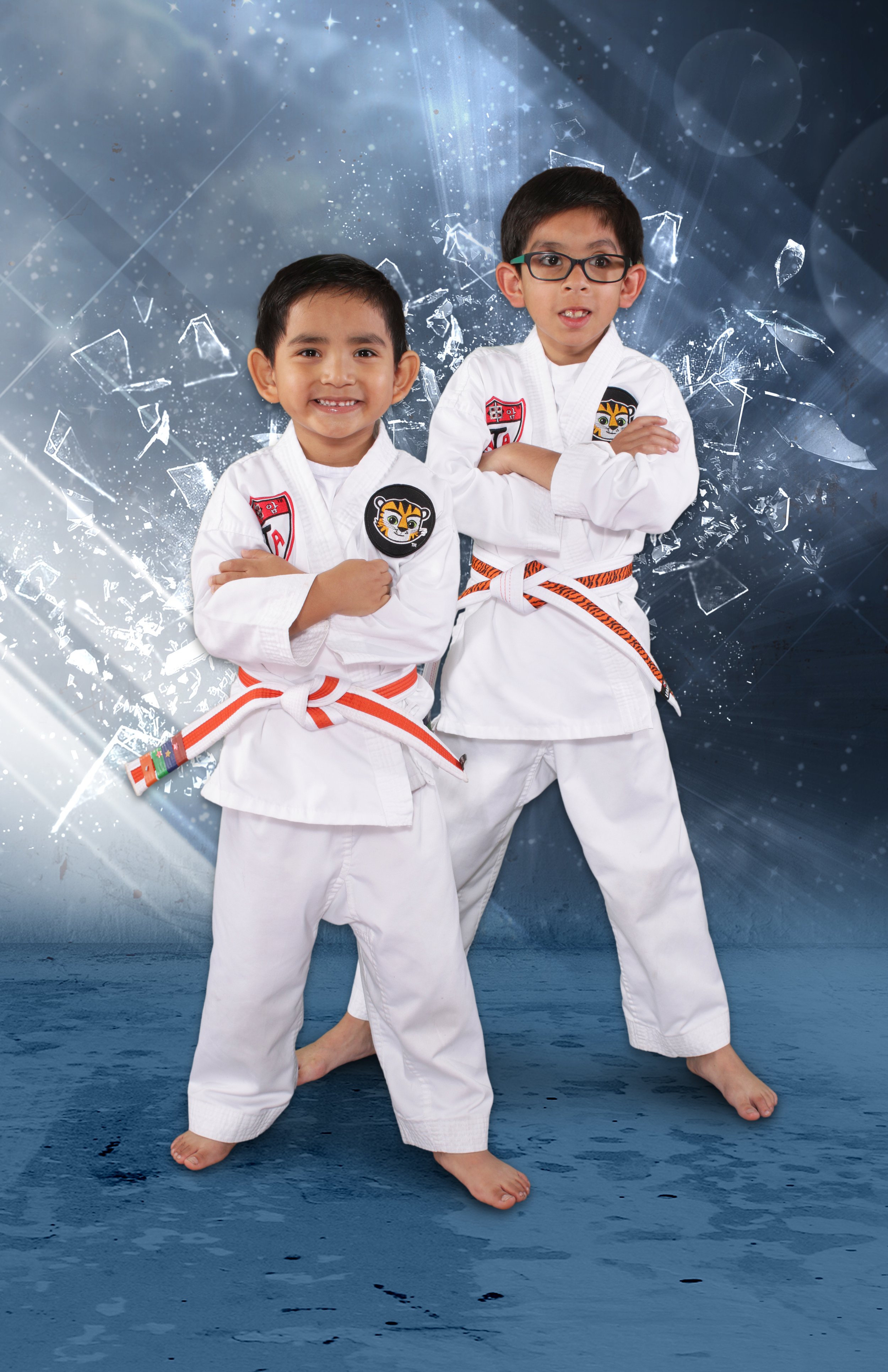 two young boys in ATA Tiger uniforms smiling