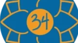 Studio 34 logo, the number 34 inside of a blue and yellow lotus