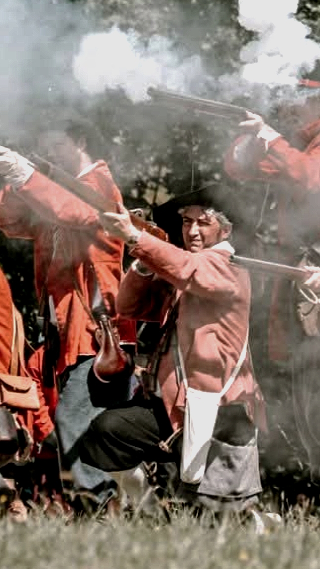 A dashing parlimentarian musketeer kneels to fire his weapon