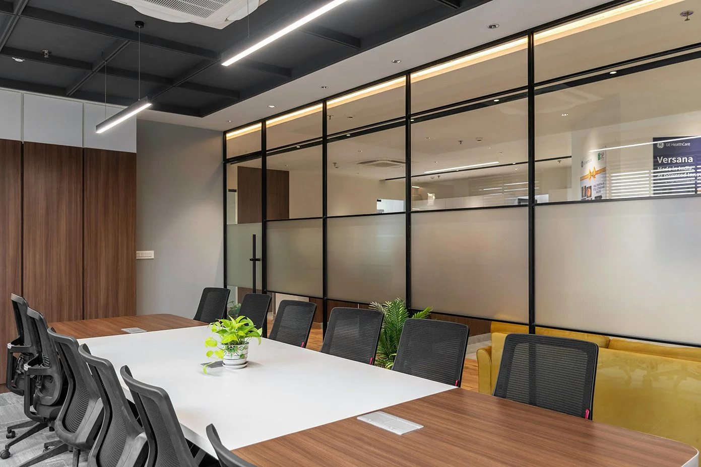 Office conference room with a large glass wall and door