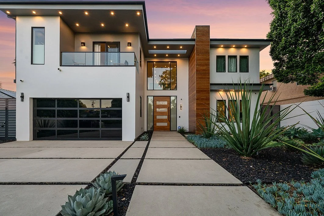 Front yard of two-story modern luxury home