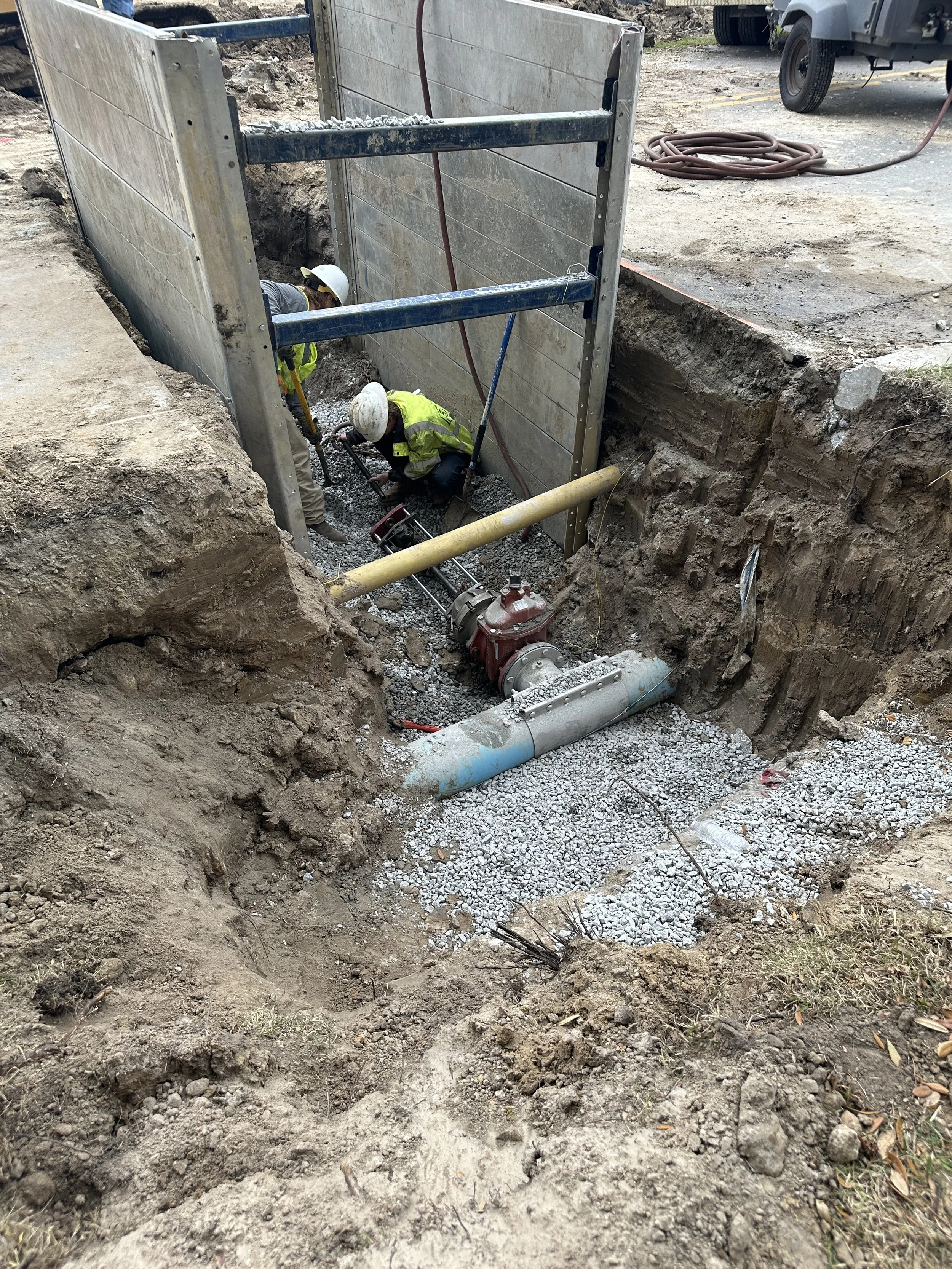 tapping saw being attached to gate valve by BJWSA in preparation for tapping watermain