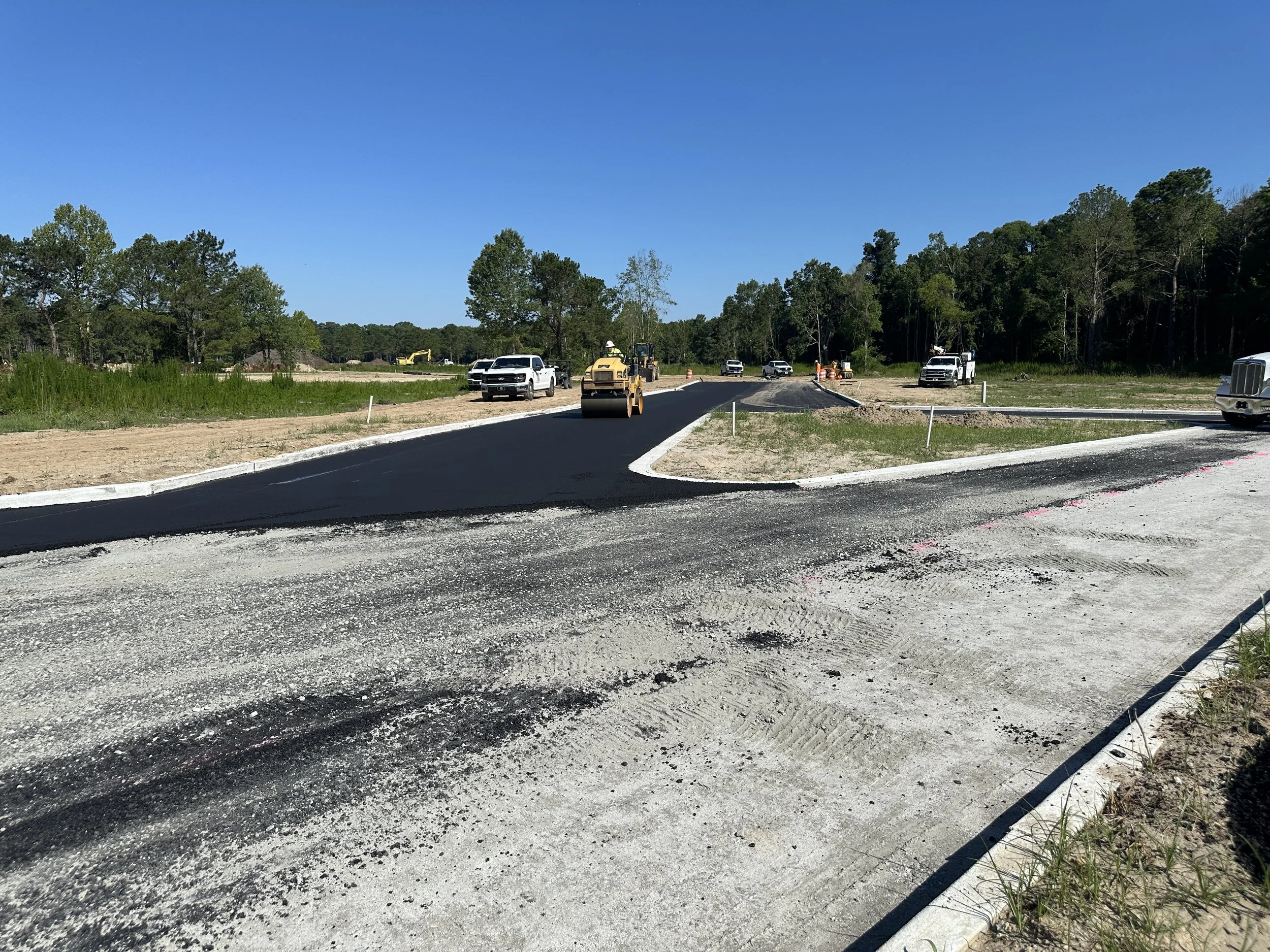 Habersham Pondcrest Phase new asphalt being rolled with double drum roller