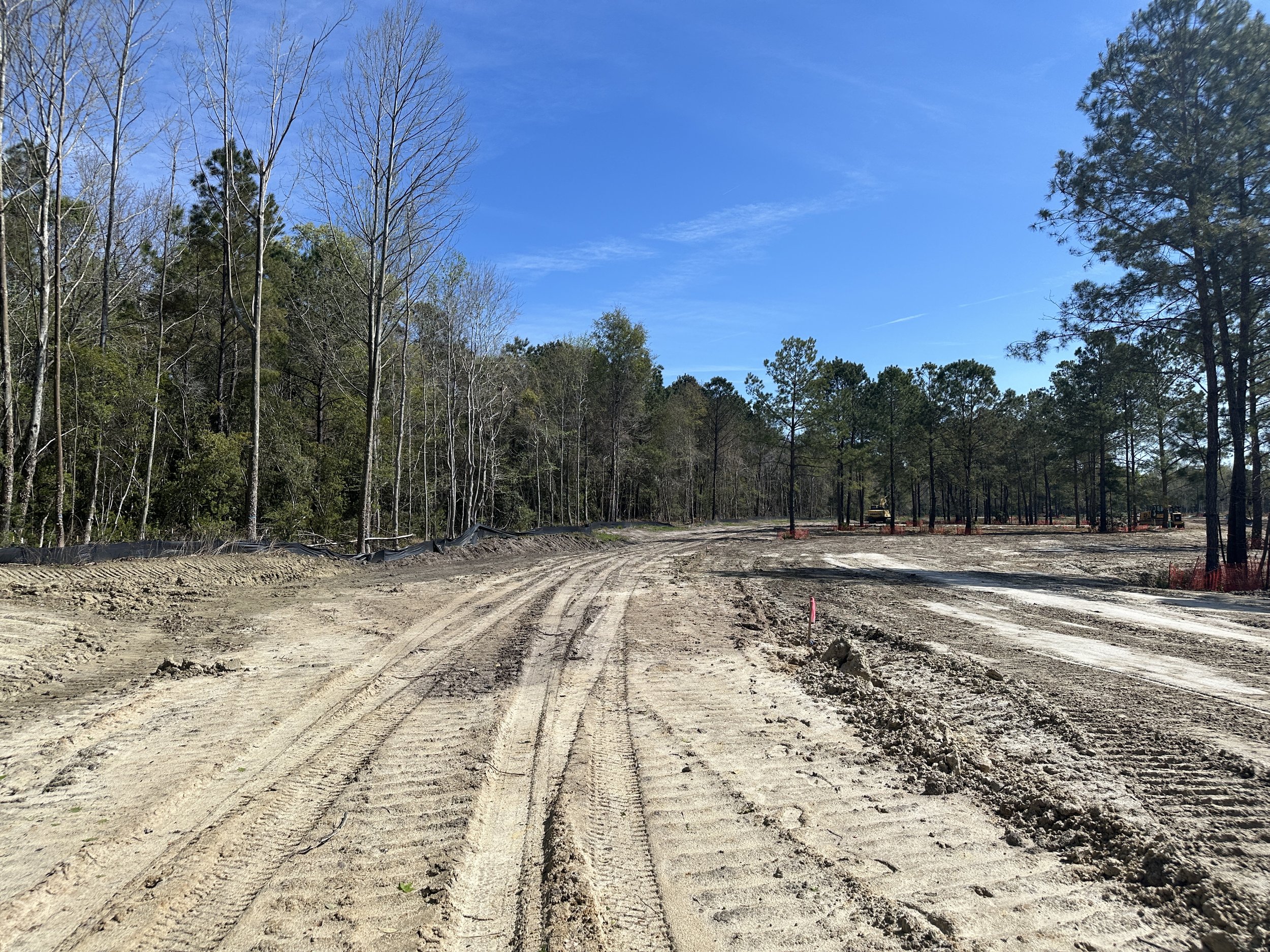 alley graded with fill dirt from pond