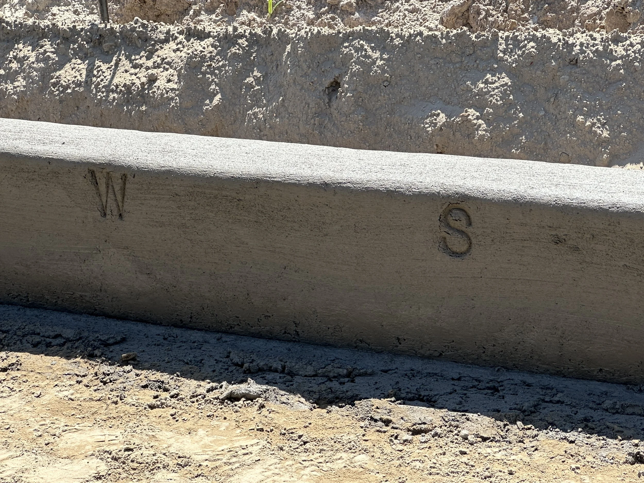 Water and Sewer locations stamped in curb per BJWSA specifications for new phase of Habersham, called Pondcrest