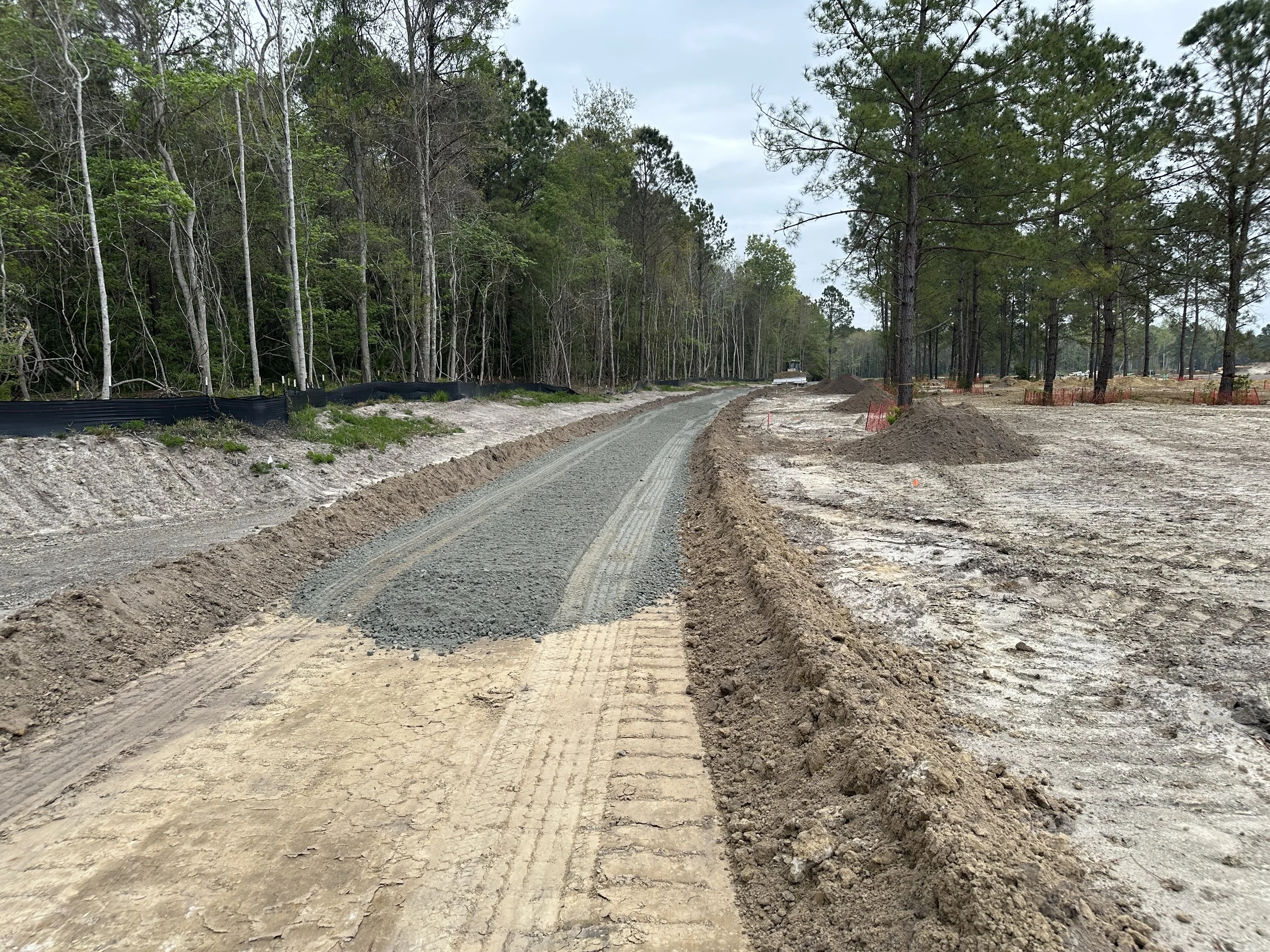 rock base being put down for road or alley