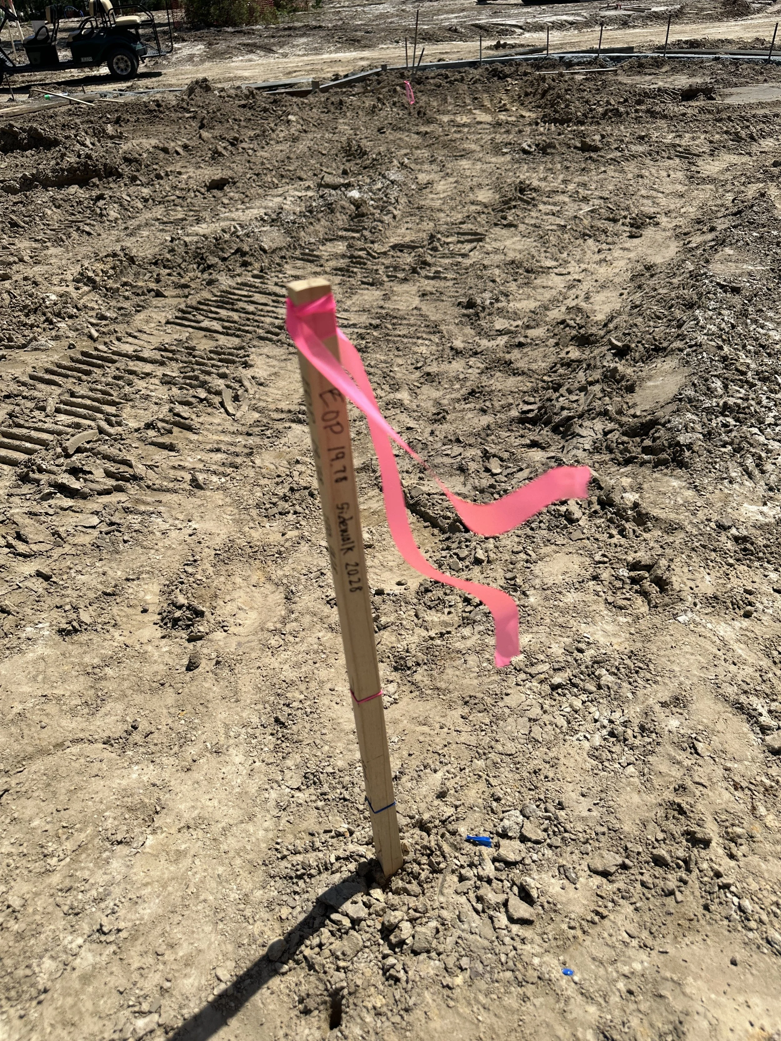 Survey stake in new phase of Habersham, called Pondcrest, that shows Edge of Pavement elevation