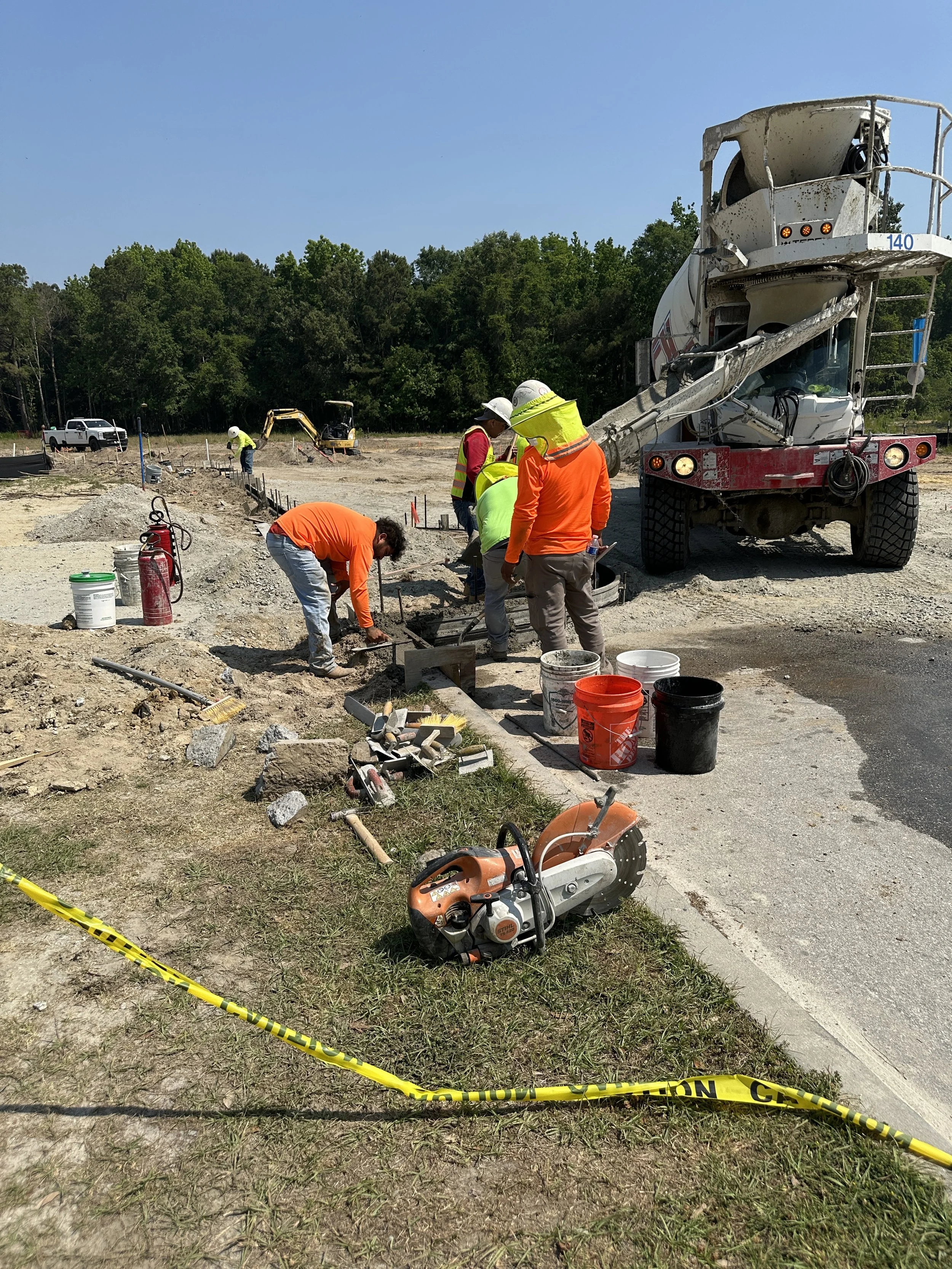 Pouring curb and hand troweling for a new curb in Pondcrest Phase of Habersham