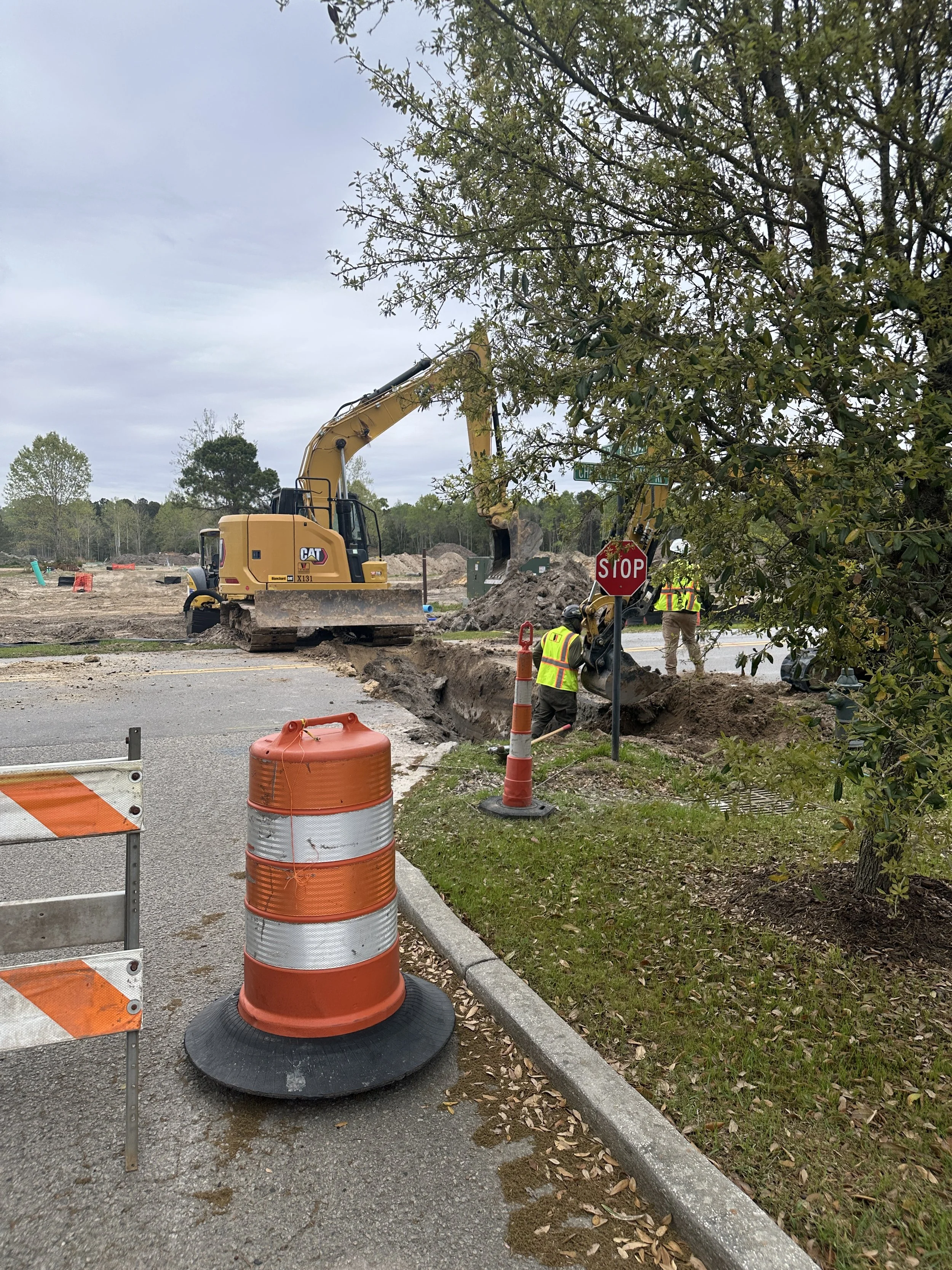 trench dug across Cherokee Farms Road to tap water main