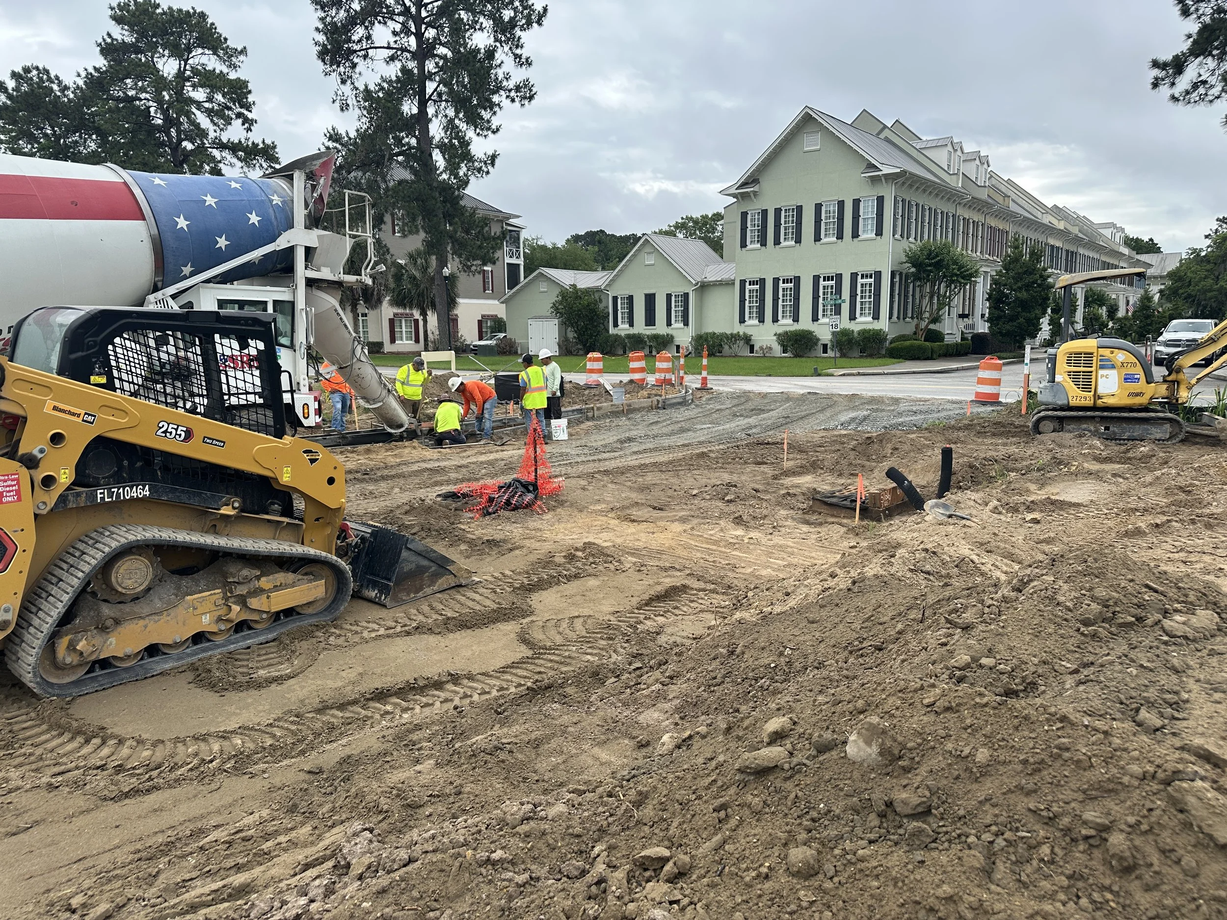 Crew hand forming curb for new phase of Habersham, called Pondcrest