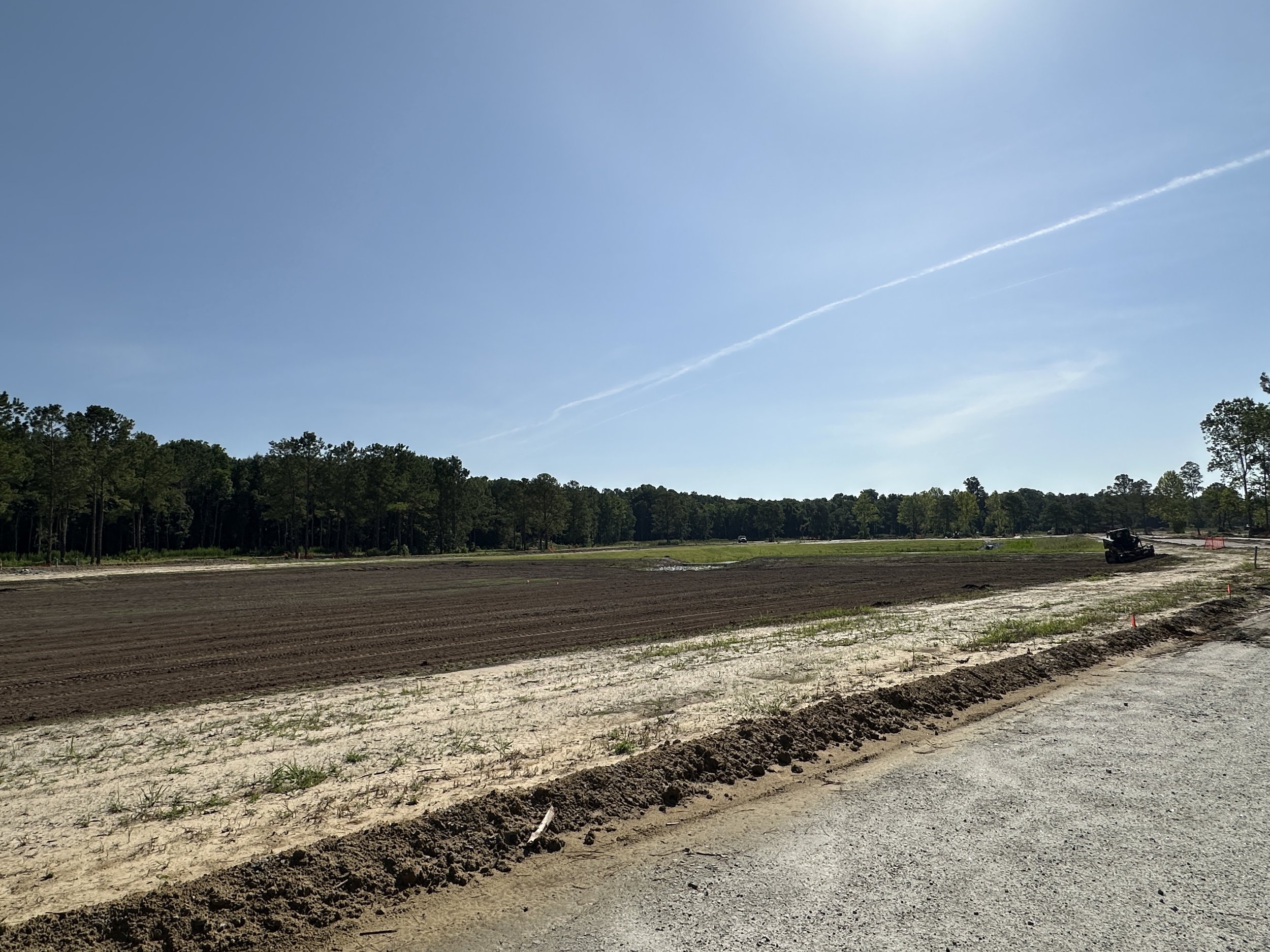 Harley Rake working in a park in Habersham Pondcrest Phase