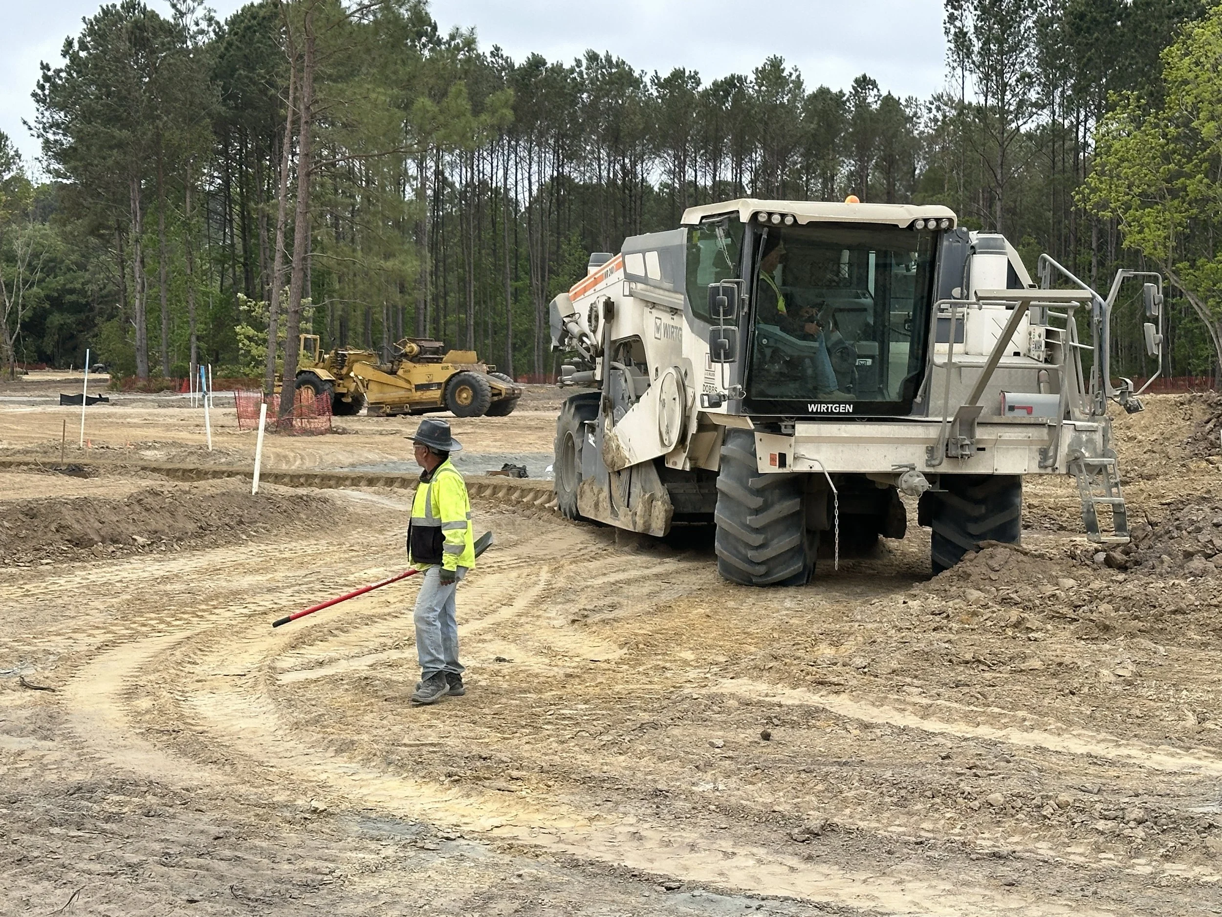 soil cement mixer being driven on new road in Pondcrest Phase of Habersham
