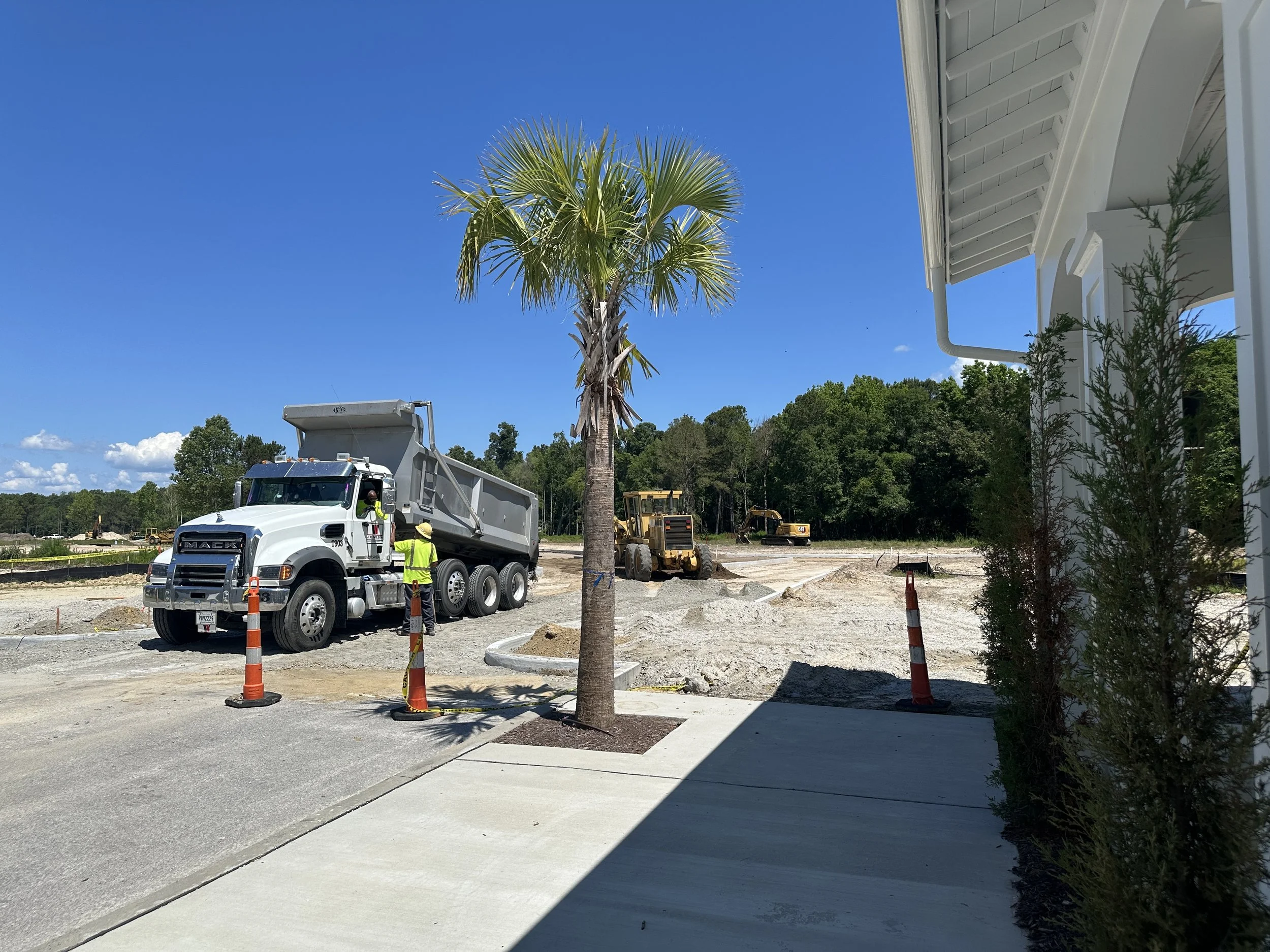 Base rock being dumped by dump truck on North Market in Pondcrest, a new phase of Habersham