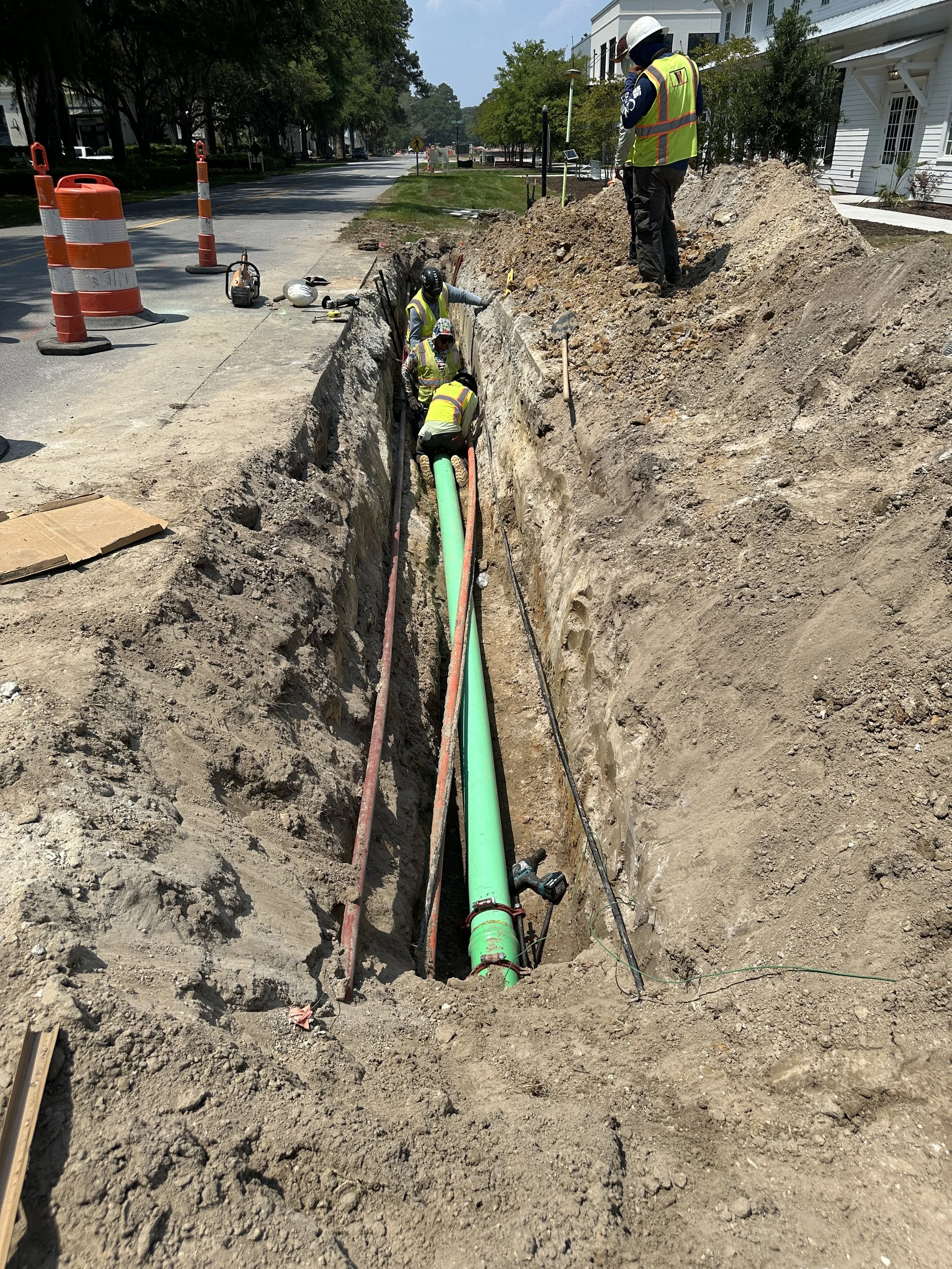 Laying forcemain in amongst other utilities along Cherokee Farms Road for Pondcrest Phase