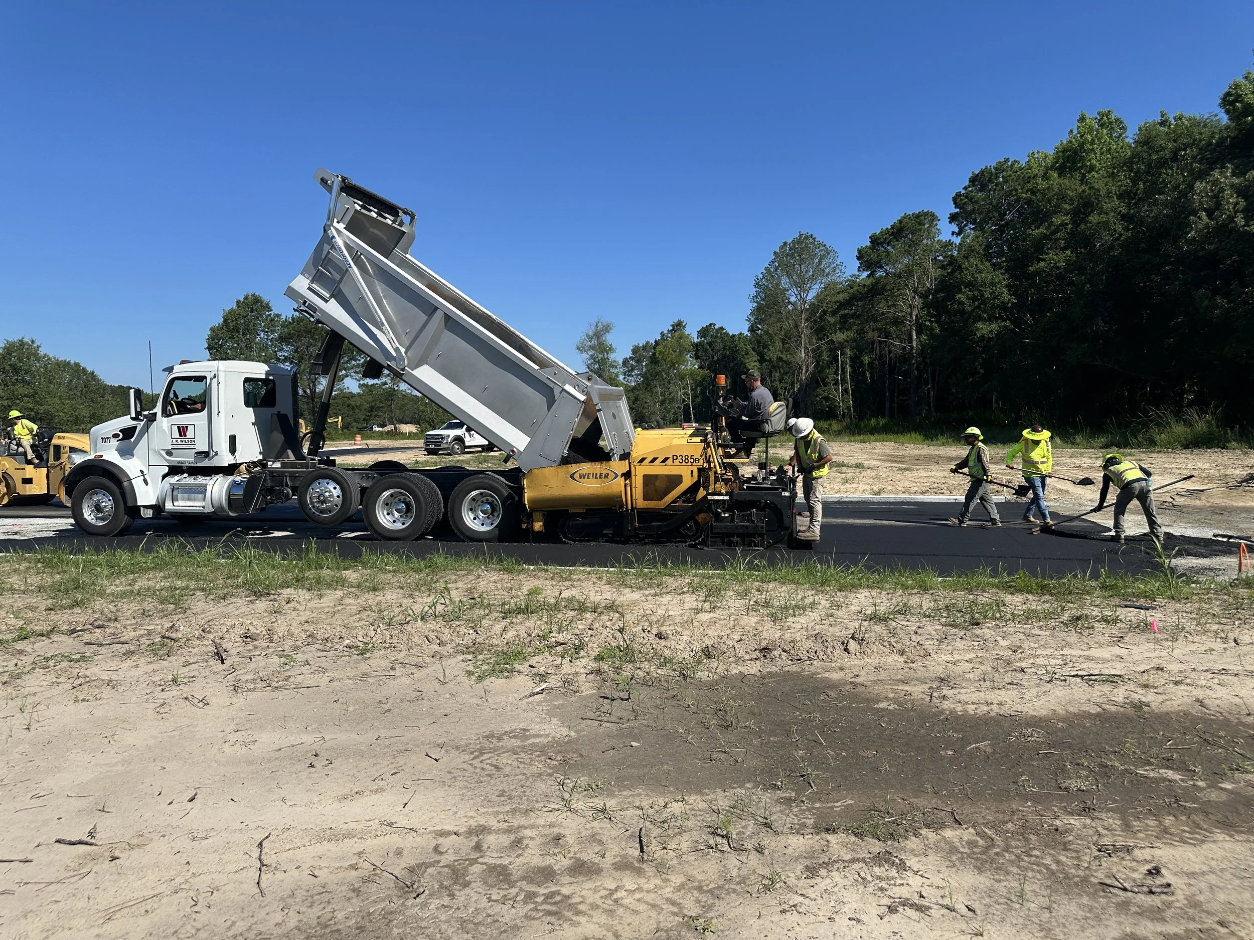 Habersham Pondcrest Phase asphalt being spread on new road