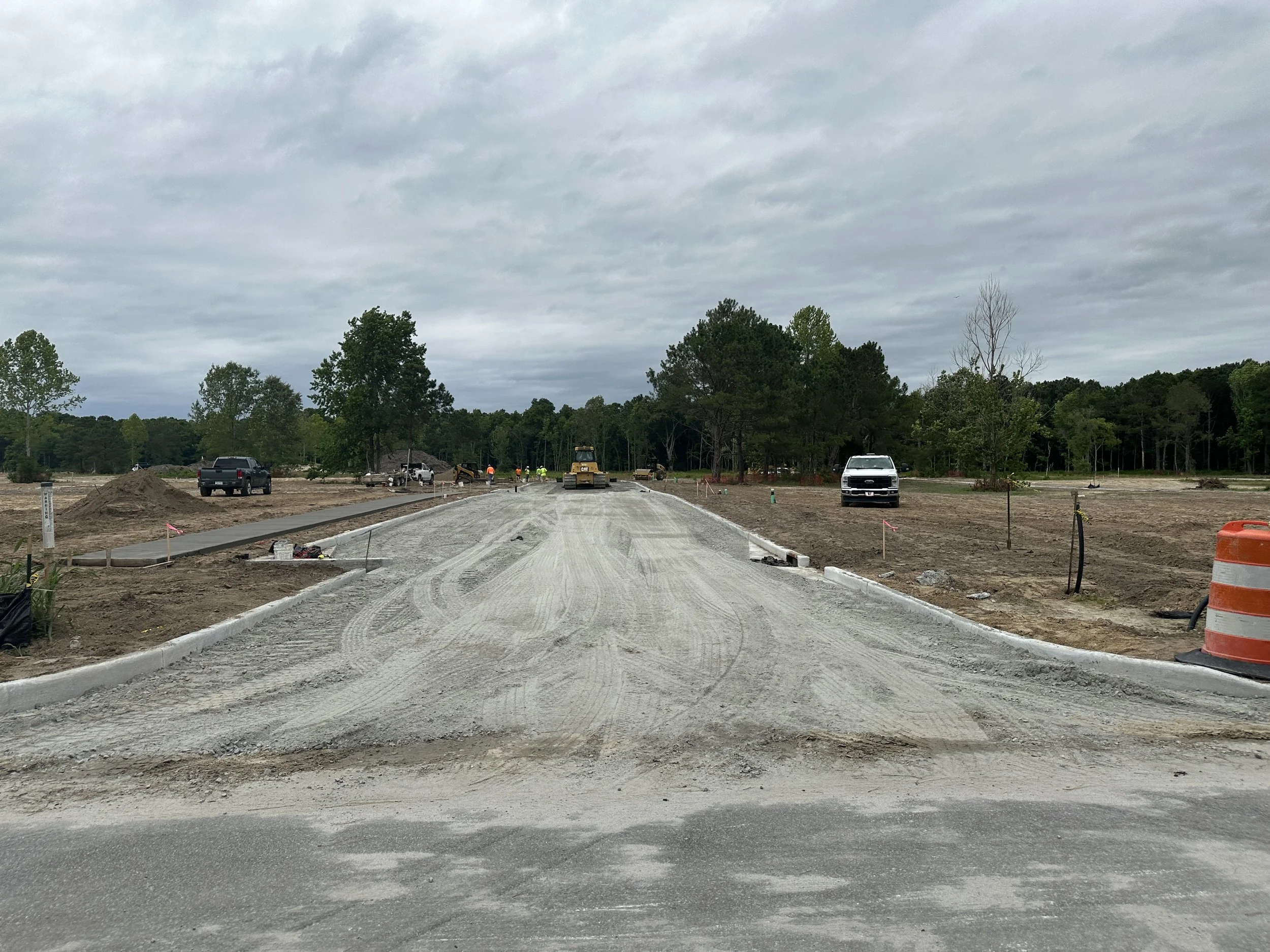 Base rock, curb and sidewalk in for now road in Pondcrest, a new phase of Habersham