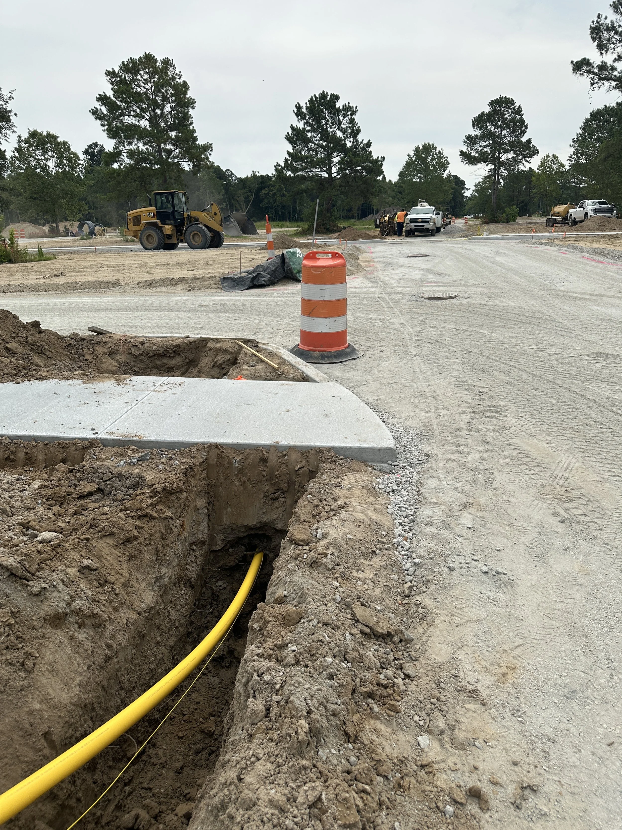 A gas line is bored under a road in Habersham Pondcrest Phase