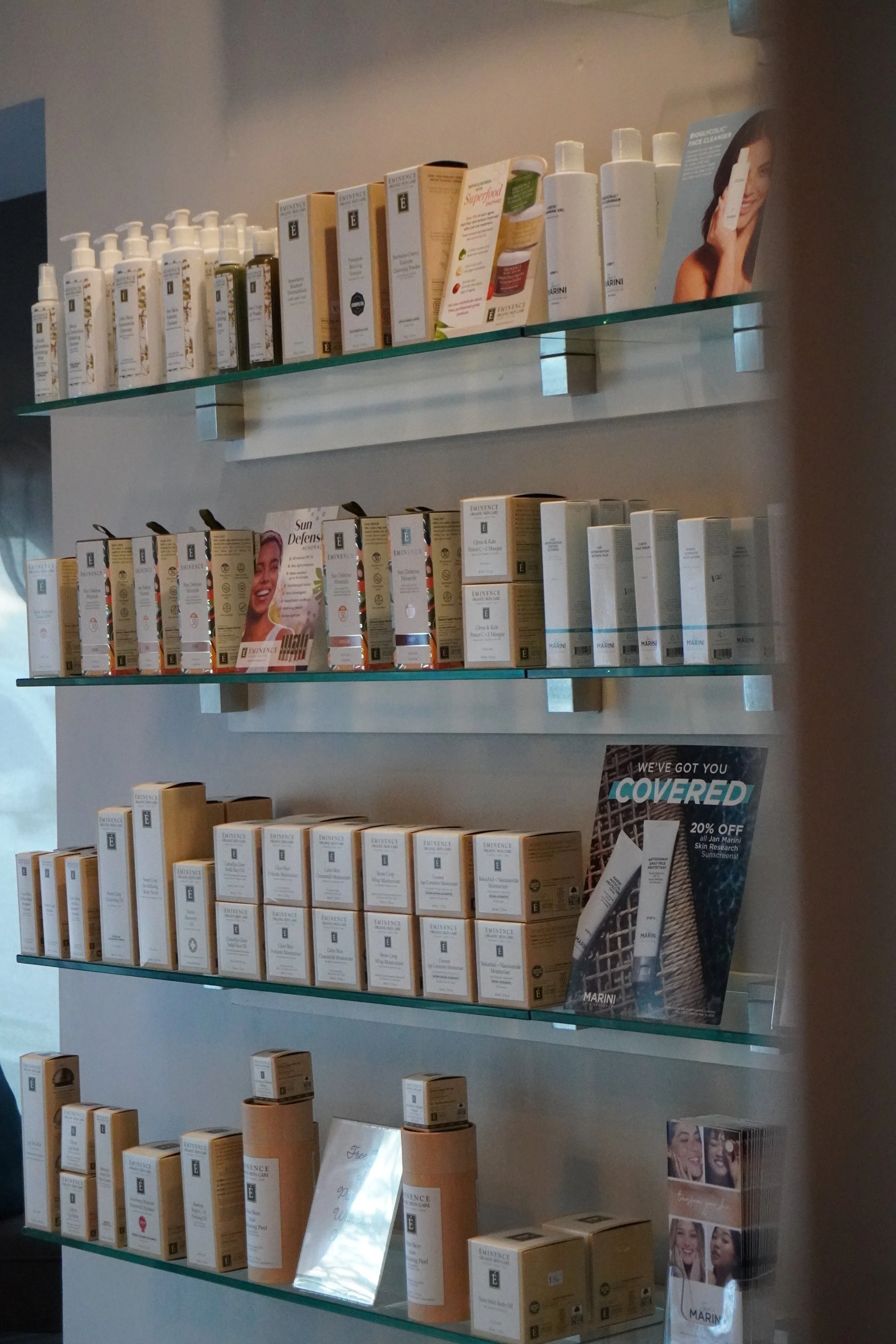 Display shelf with various premium skincare products.