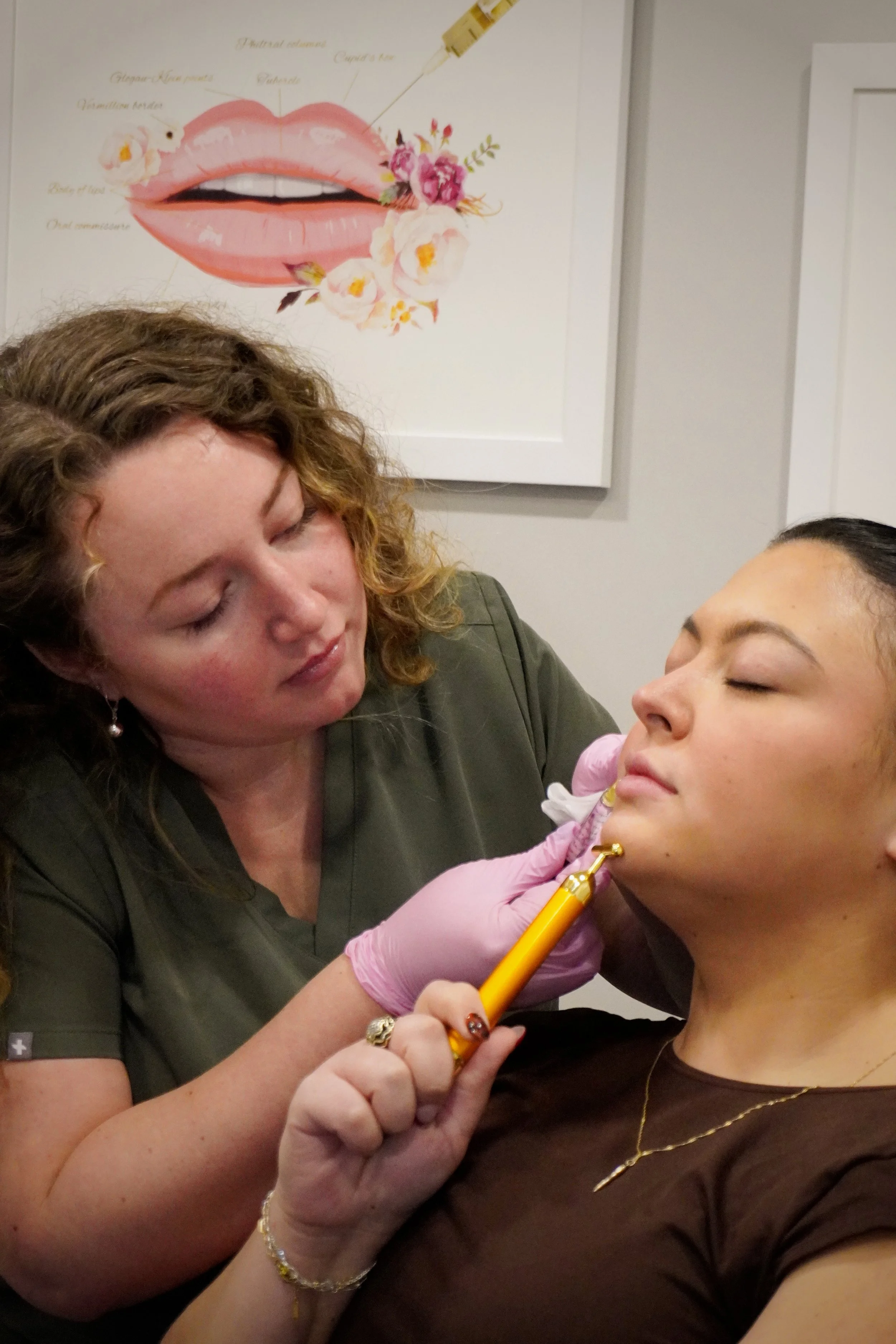 A woman receiving a cosmetic injection from a healthcare professional wearing pink gloves in a clinical setting.