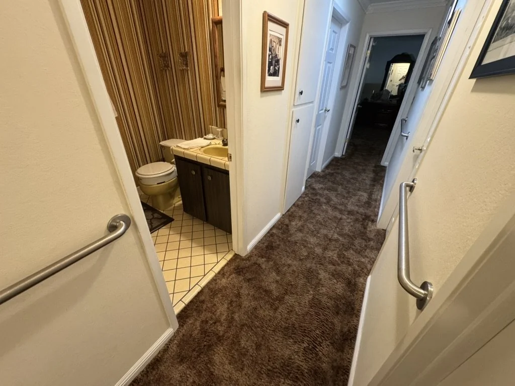 Hallway grab bars installed for mobility support, residential safety modification