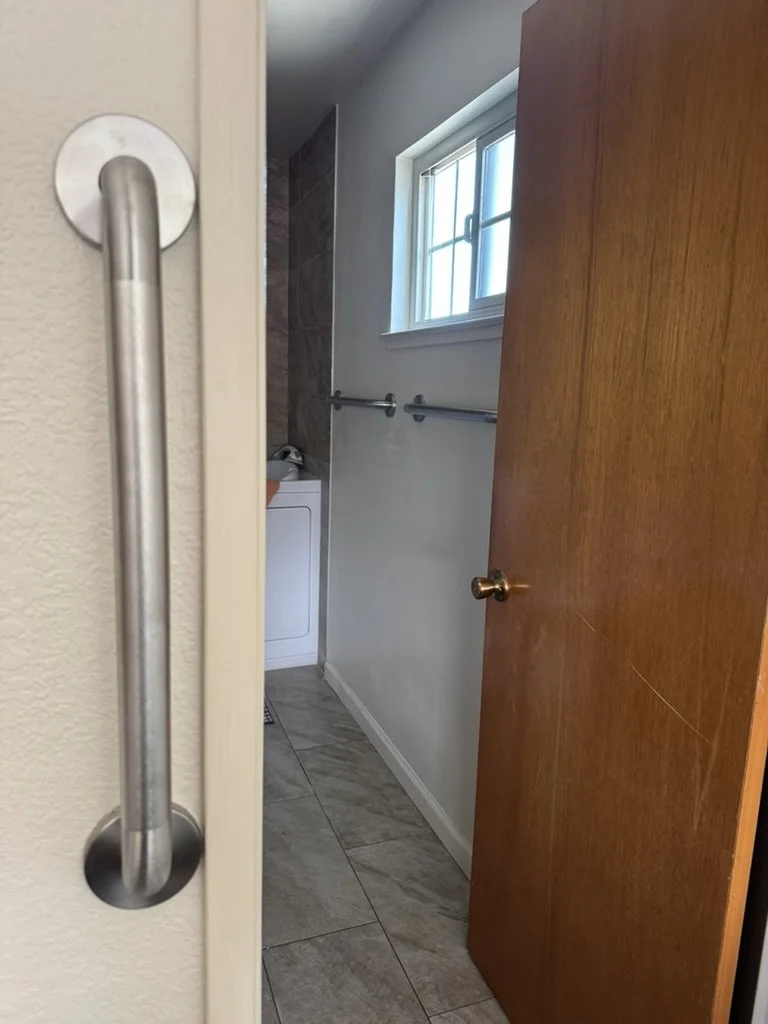 Entry door grab bar installation, bathroom entry accessibility modification, grab bar towel racks
