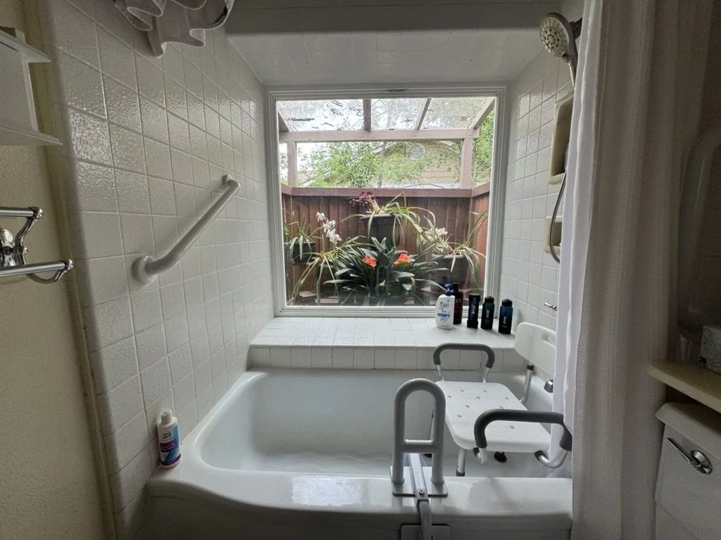 Bathtub grab bar system with shower bench and garden window, residential accessibility upgrade