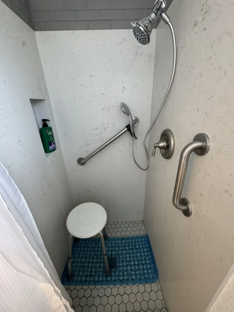 Walk-in shower alternate angle showing grab bar placement and accessibility features