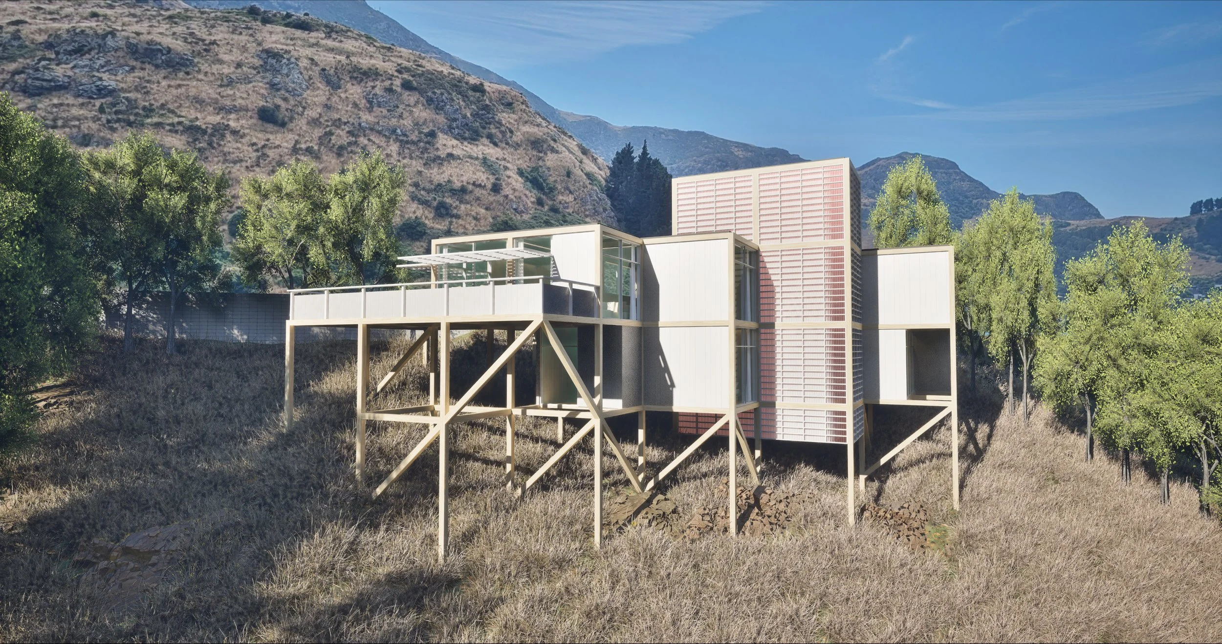 A modern house on stilts with a hillside and trees in the background under a clear sky.