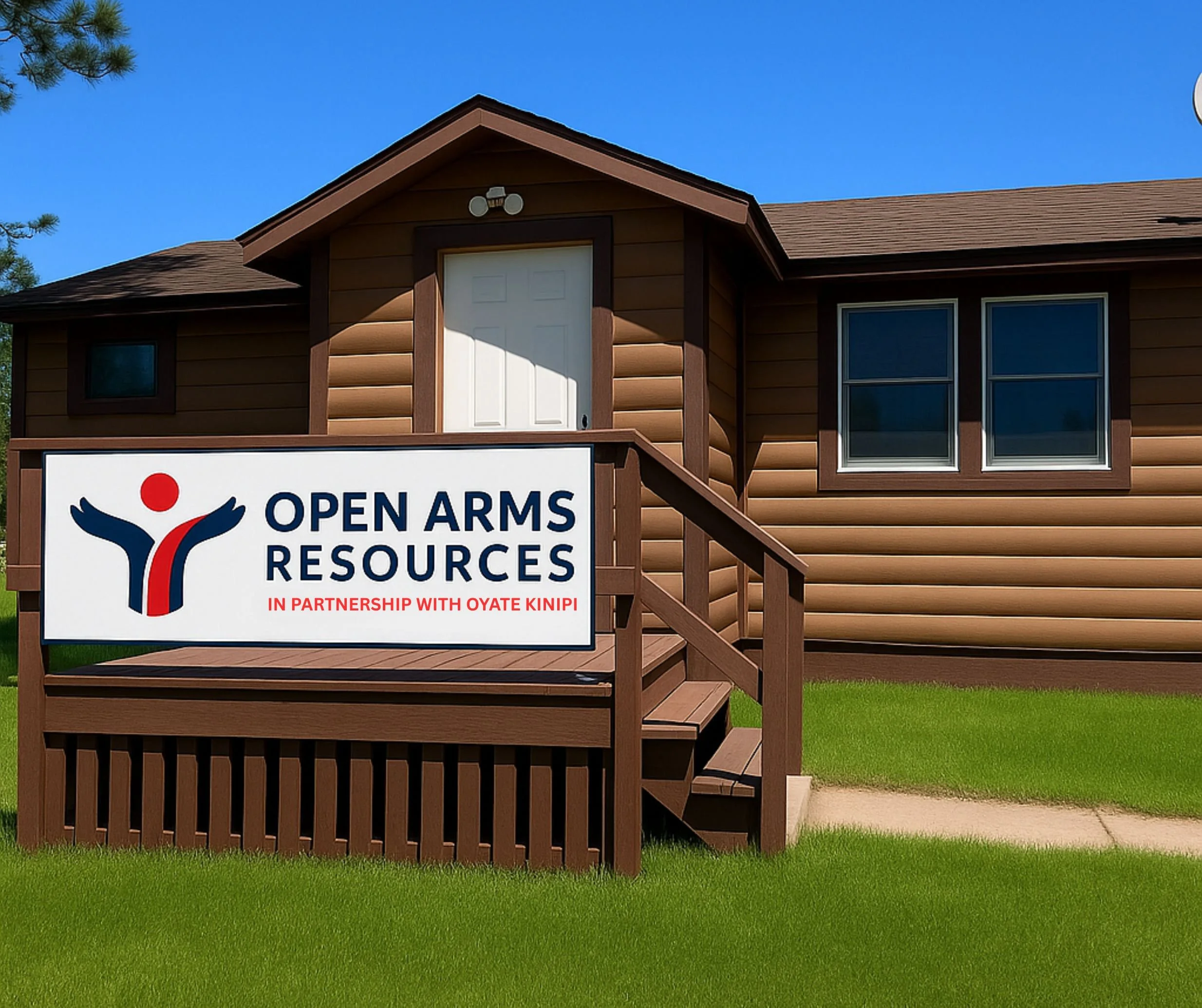 A building with brown siding, white door, and two windows. In front, a sign reads "Open Arms Resources" with a logo of a stylized person and mentions partnership with OYATE KINIPI. The grass is green, and the sky is blue.