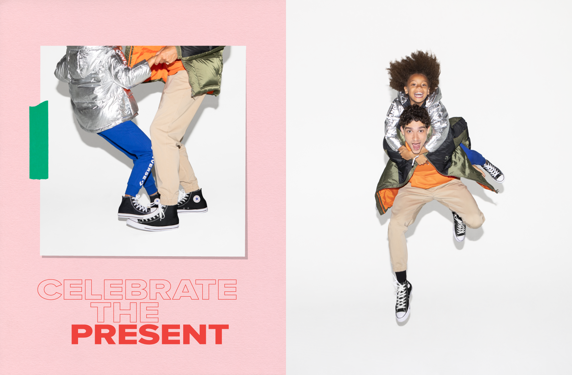 Two people jumping and playing together in a studio with a white background. One is a woman with curly hair, wearing a shiny silver jacket, and the other is a man in beige pants and a green and black jacket. The woman is sitting on the man's back, and they are both smiling happily.