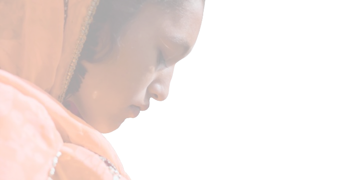 Close-up of a young woman in an orange sari